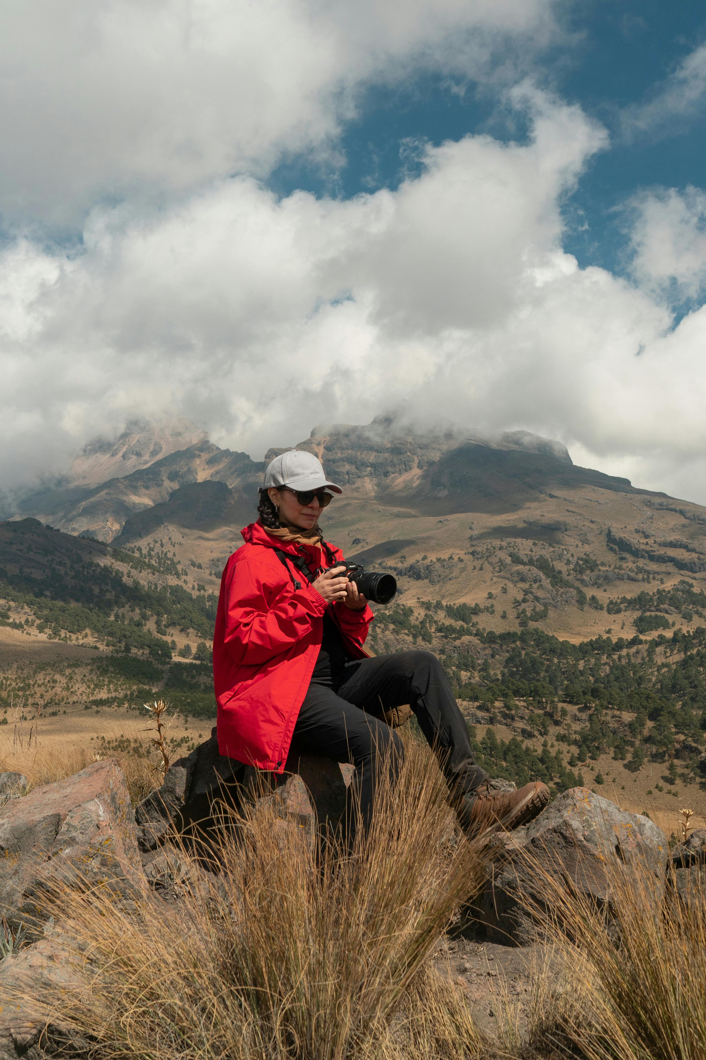 Photographer Resting on Mountain Overlook