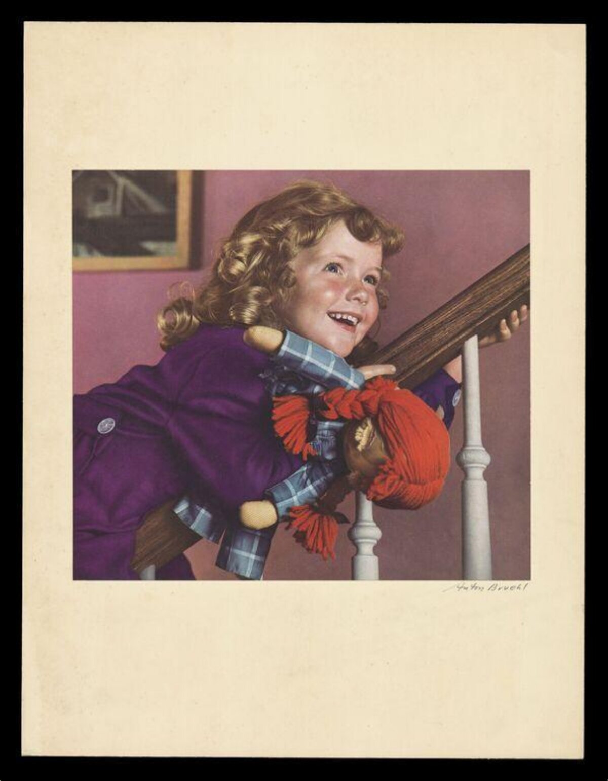 Smiling Girl With Ragdoll on Stair Railing