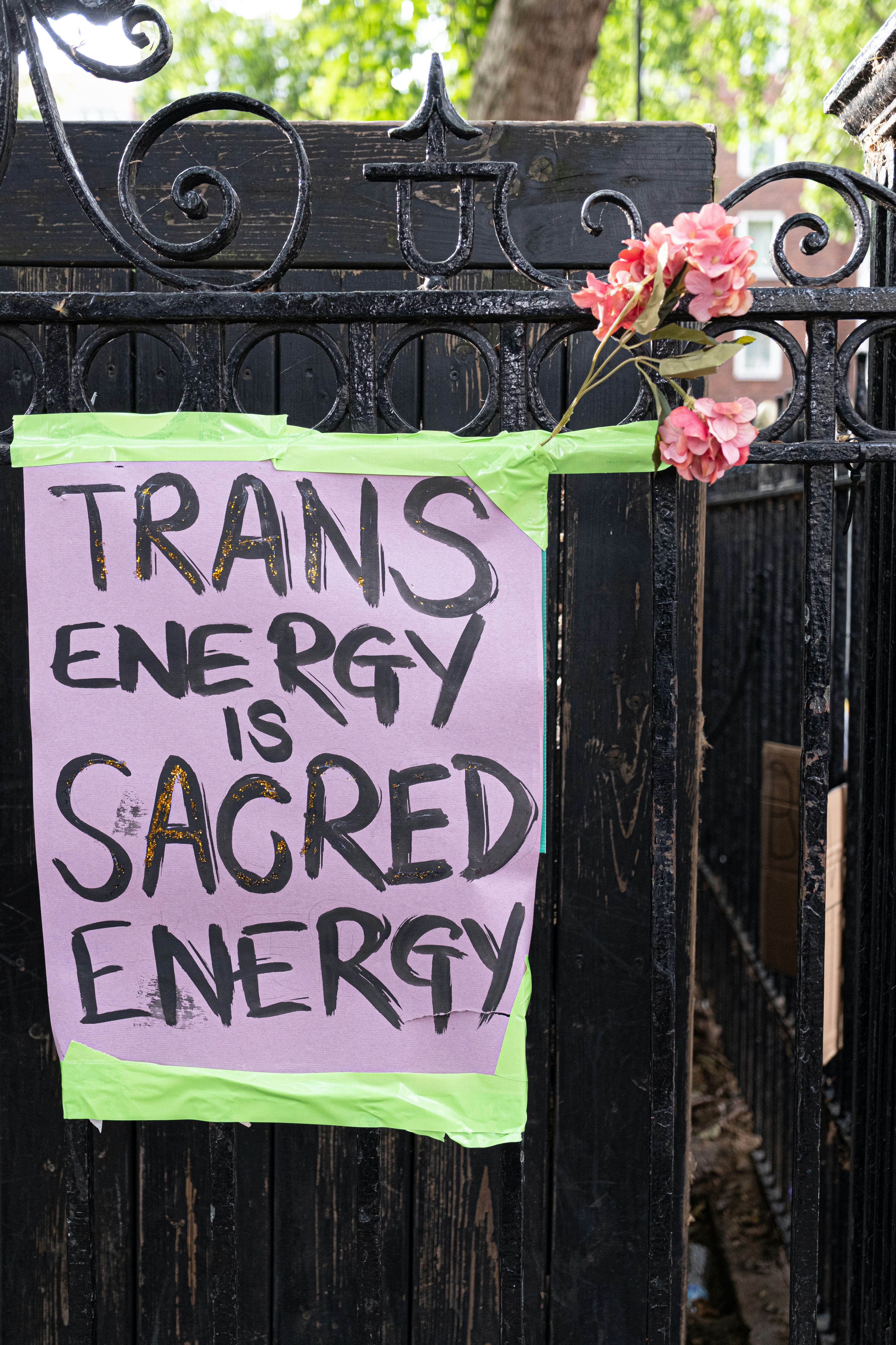 Pro-Trans Sign On Black Iron Gate