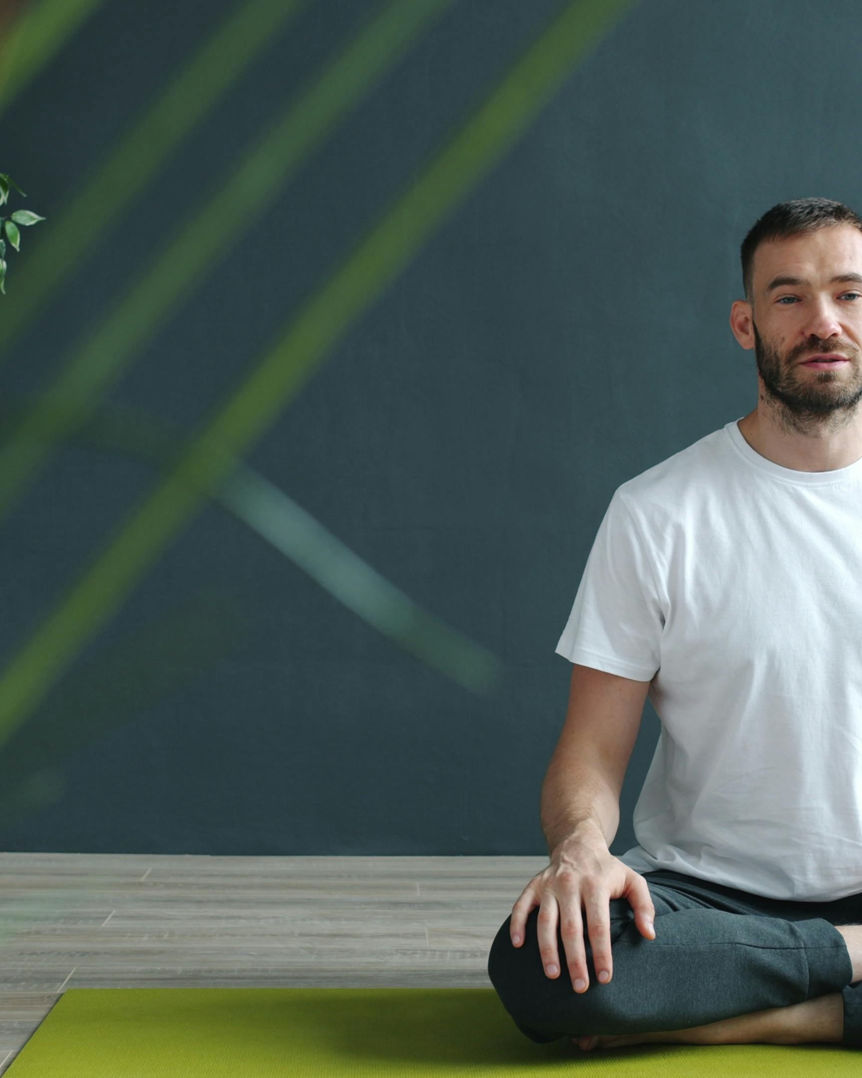 Man Meditating on Yoga Mat