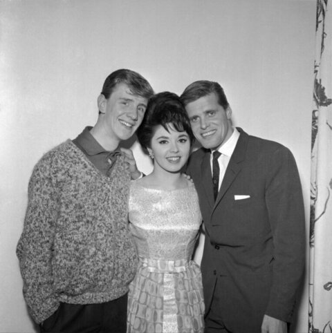 Three People Posing for Black and White Portrait