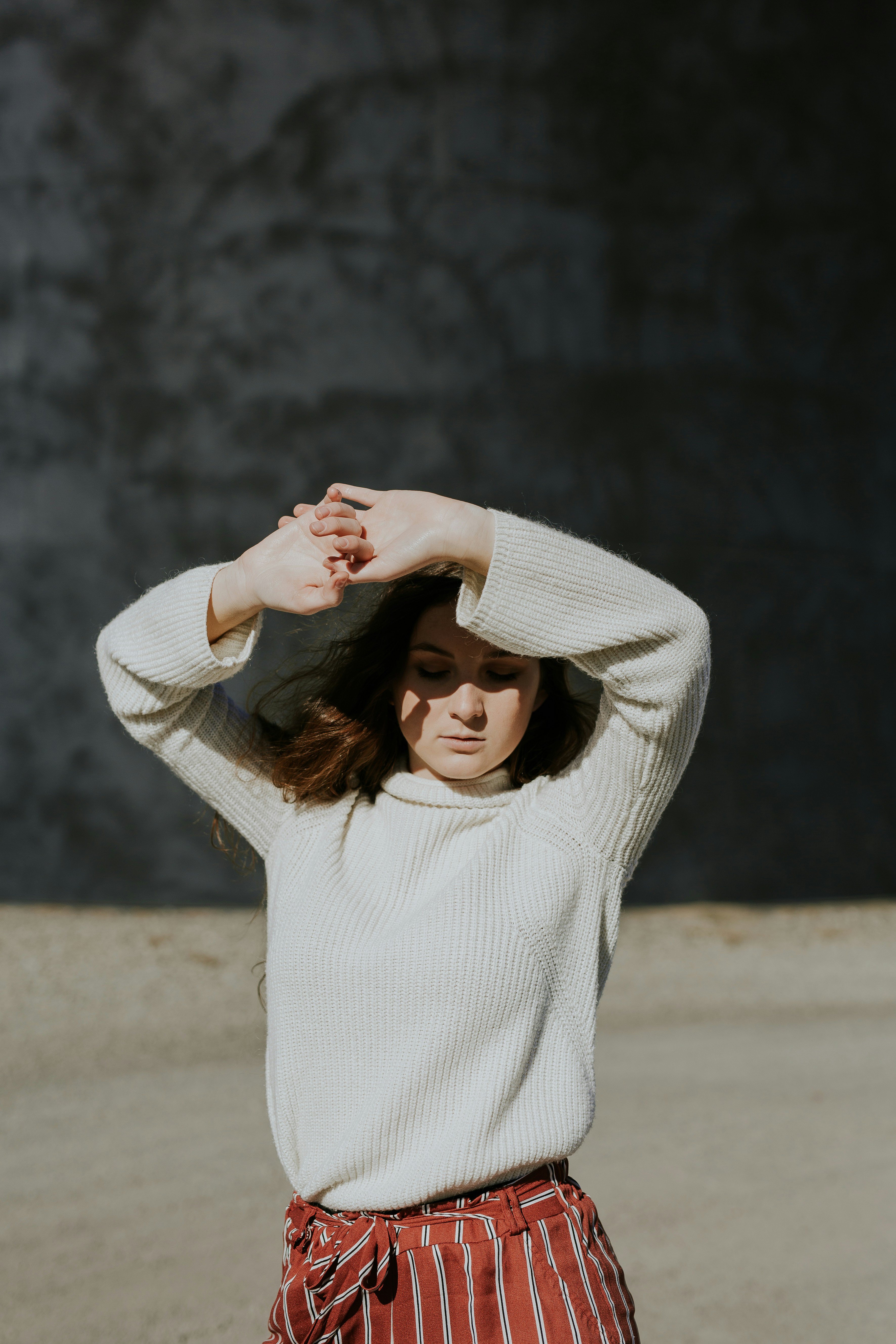 Woman Posing Outdoors in Knit Sweater