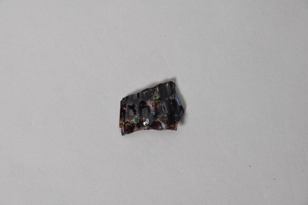 Black Opal Specimen on Gray Background