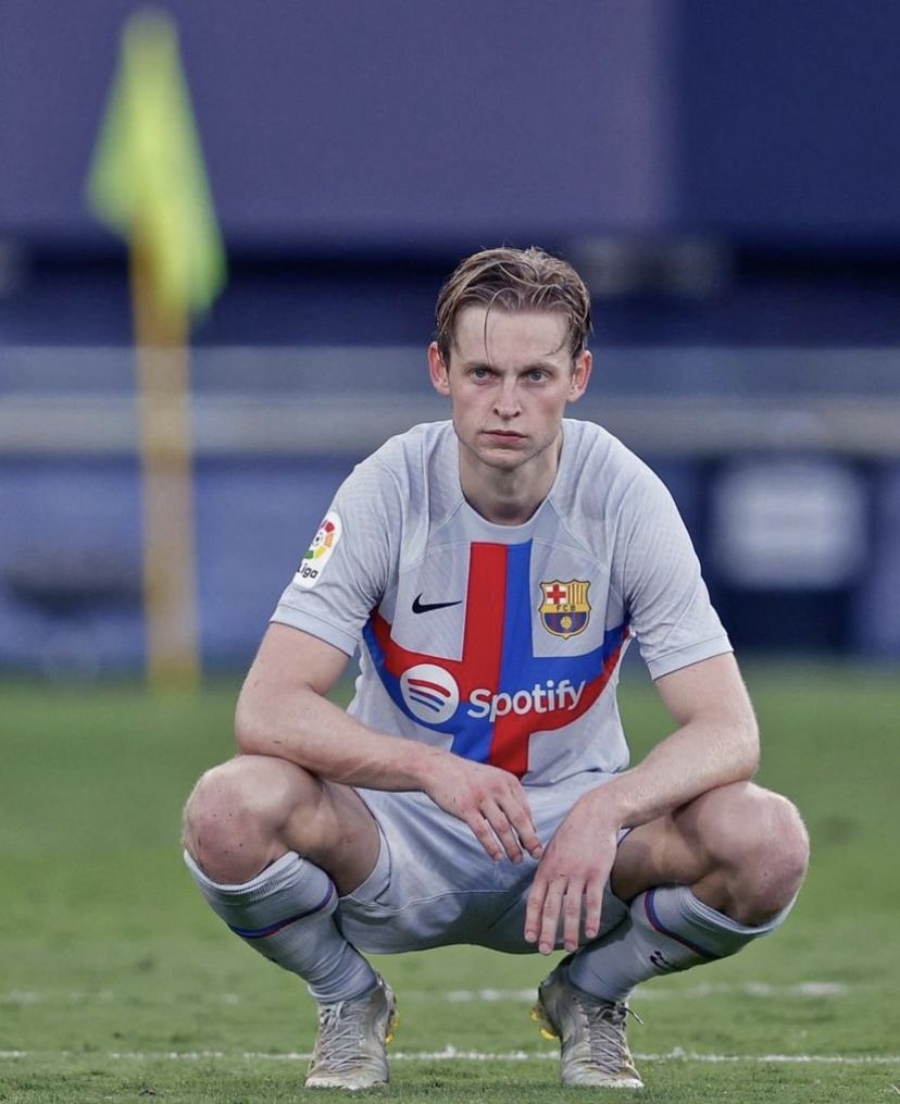 Frenkie de Jong Squatting on Football Pitch