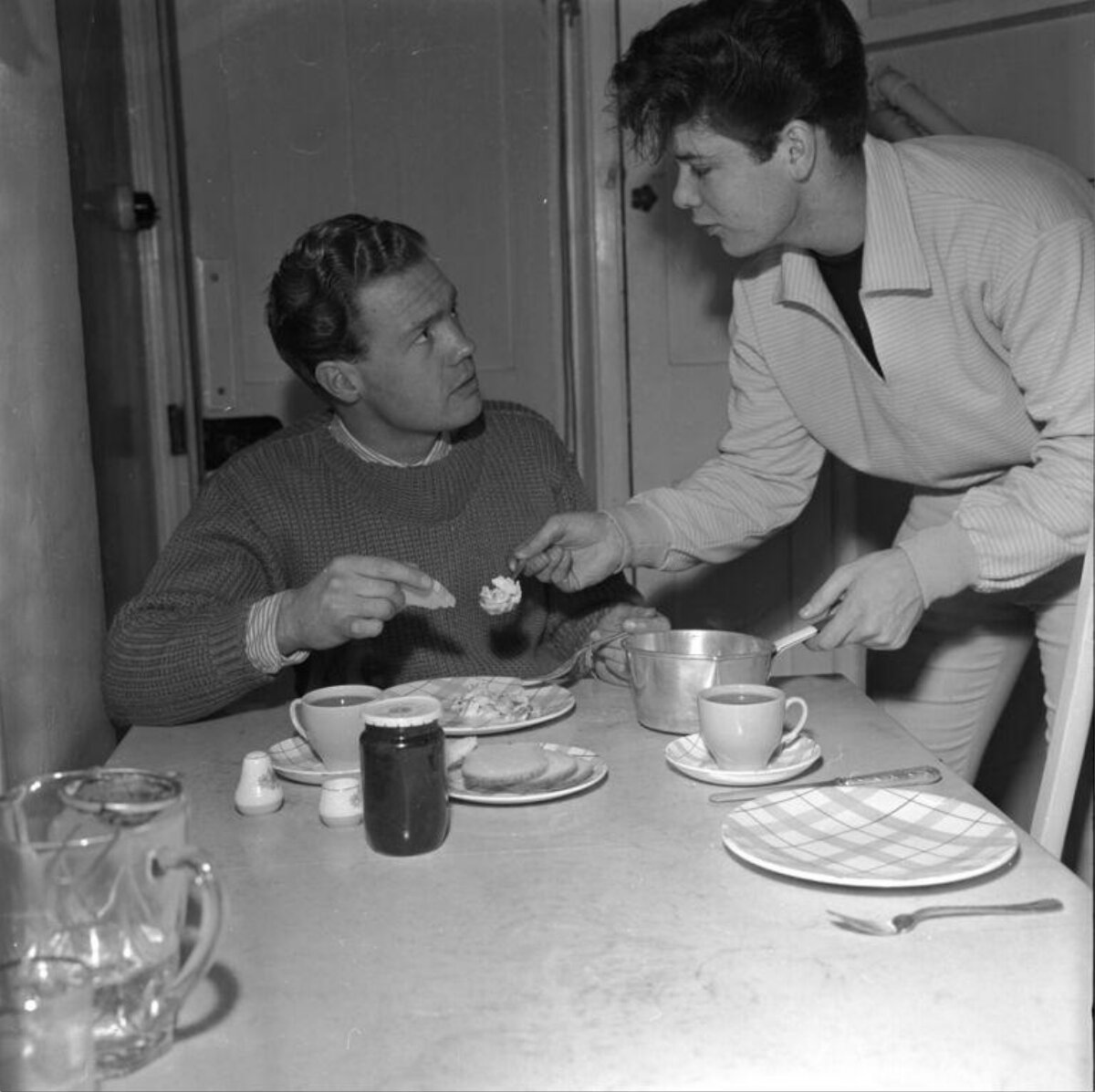 Two Men Sharing a Meal at Table