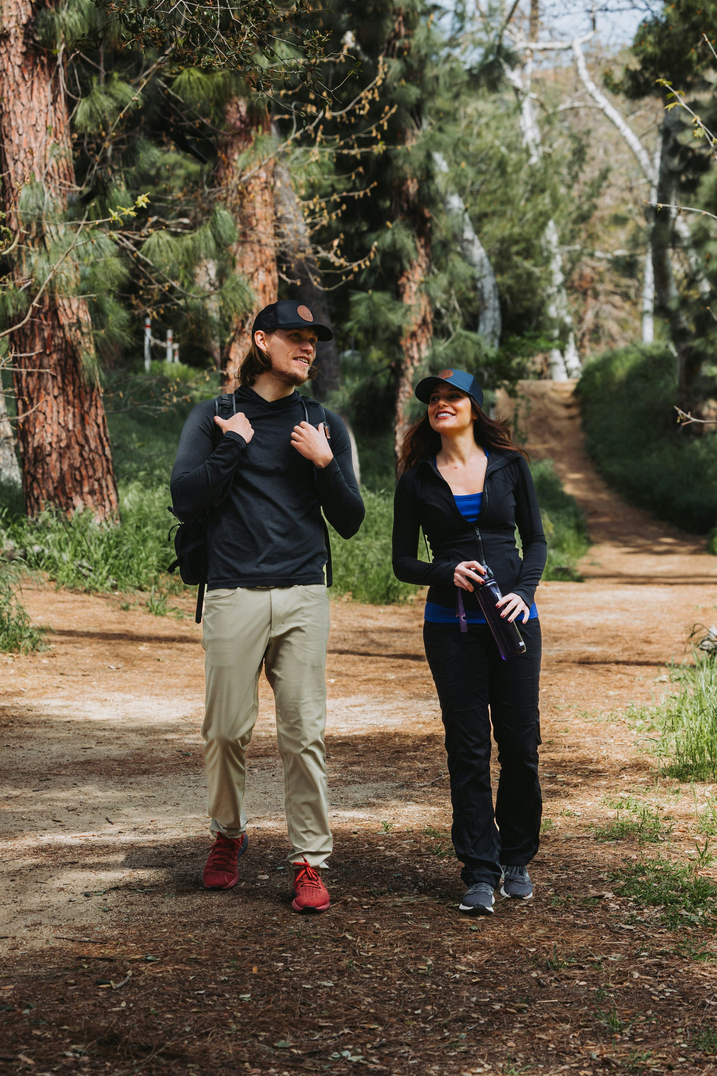 Two Hikers on a Forest Trail