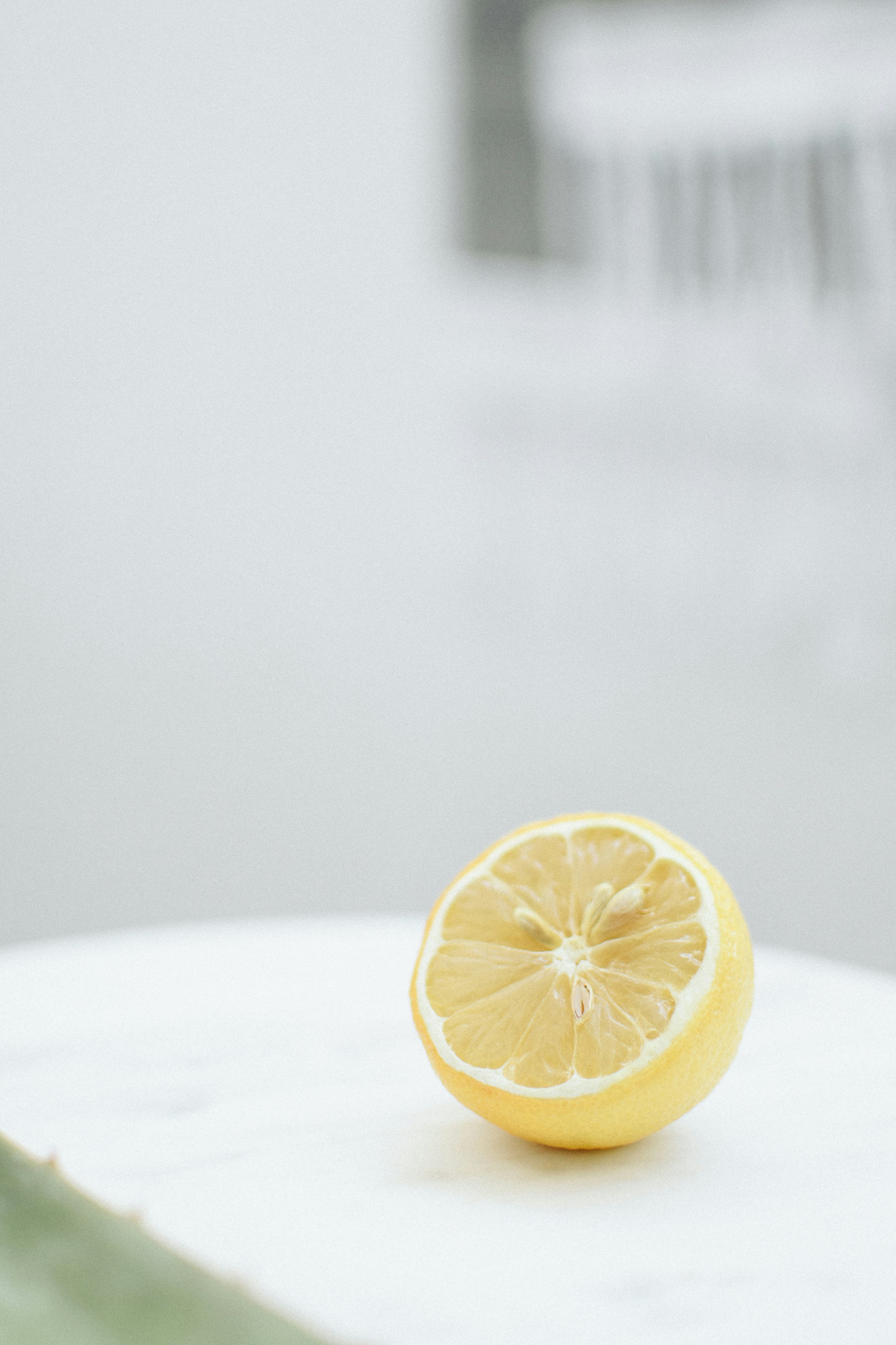 Halved Lemon on White Surface