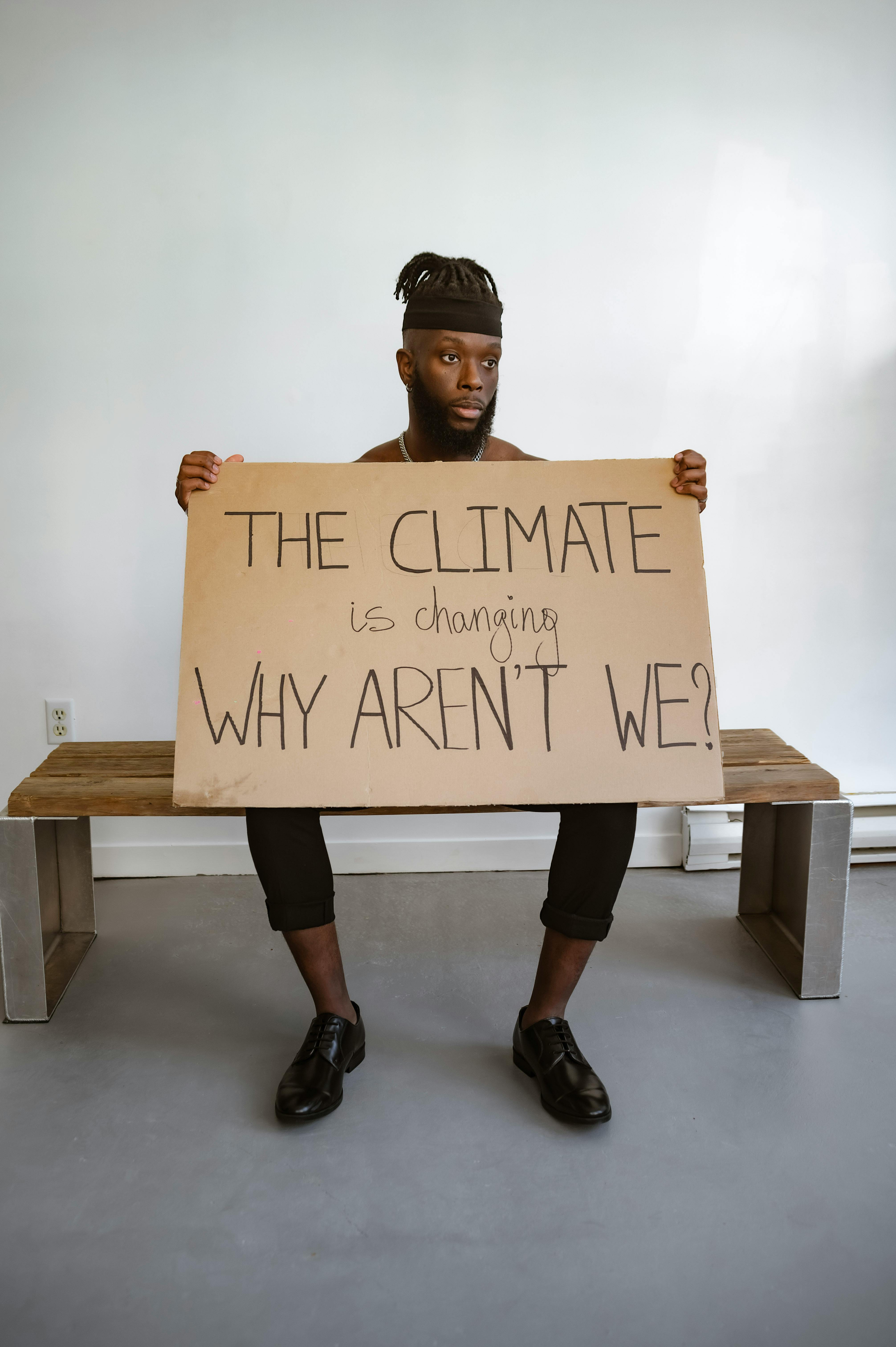 Man Holding Climate Change Protest Sign