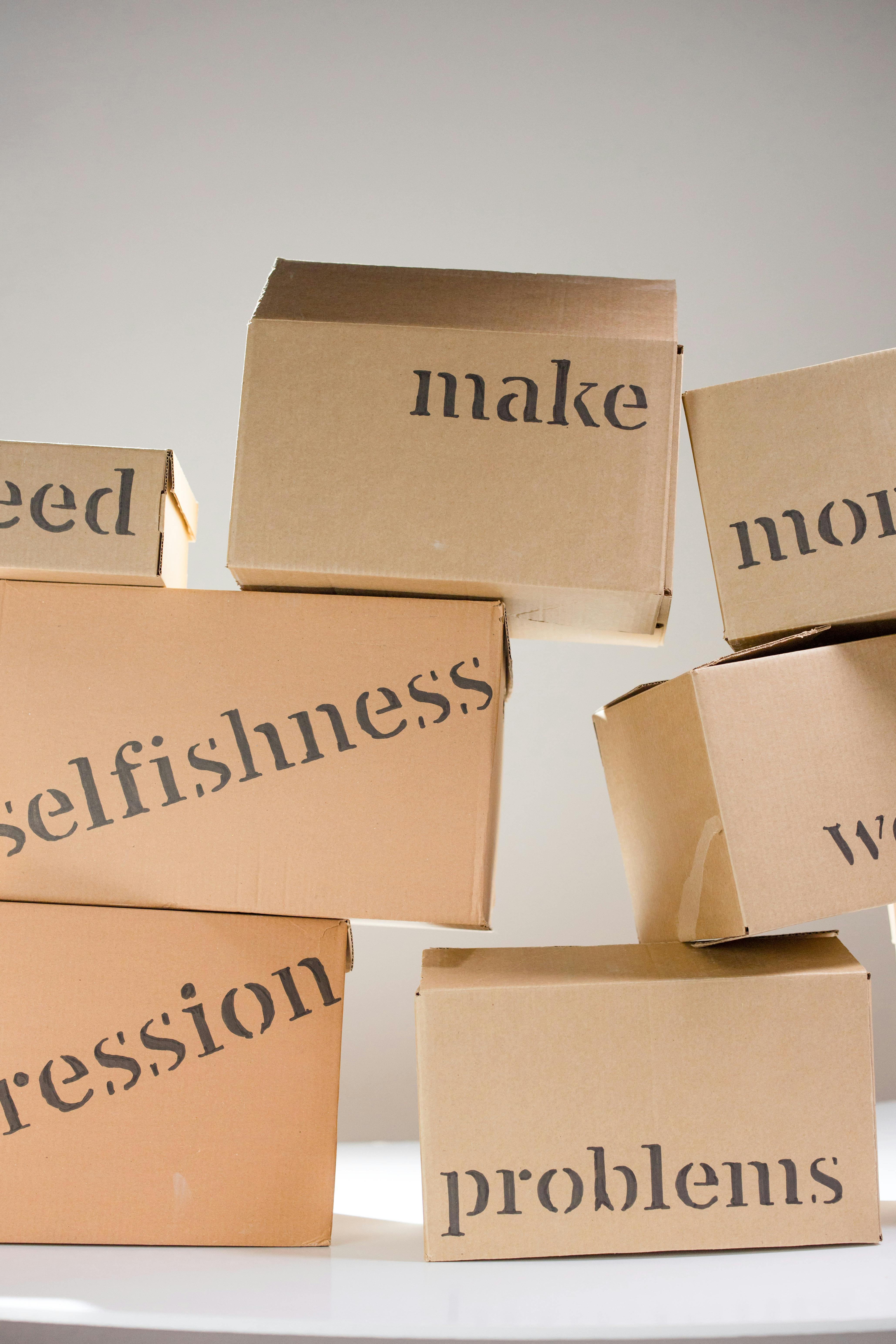 Cardboard Boxes With Negative Word Labels
