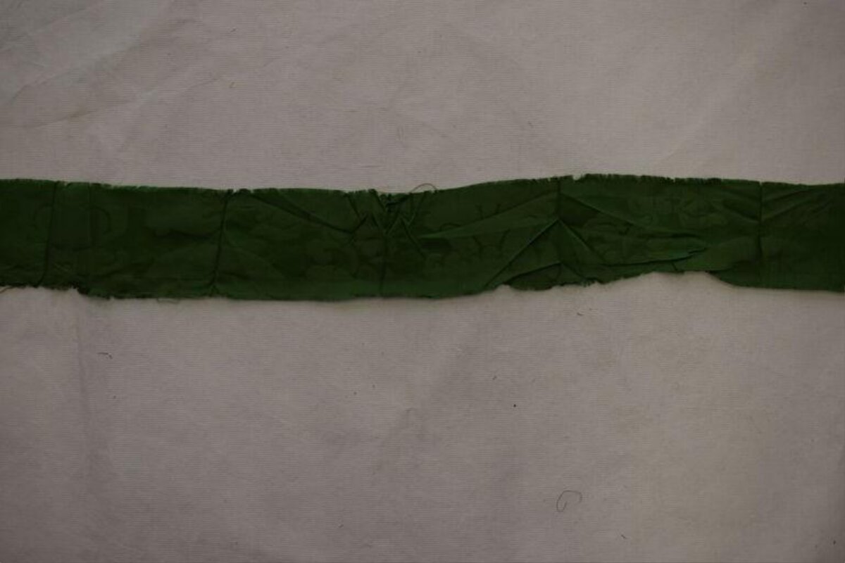 Green Fabric Strip on Light Background