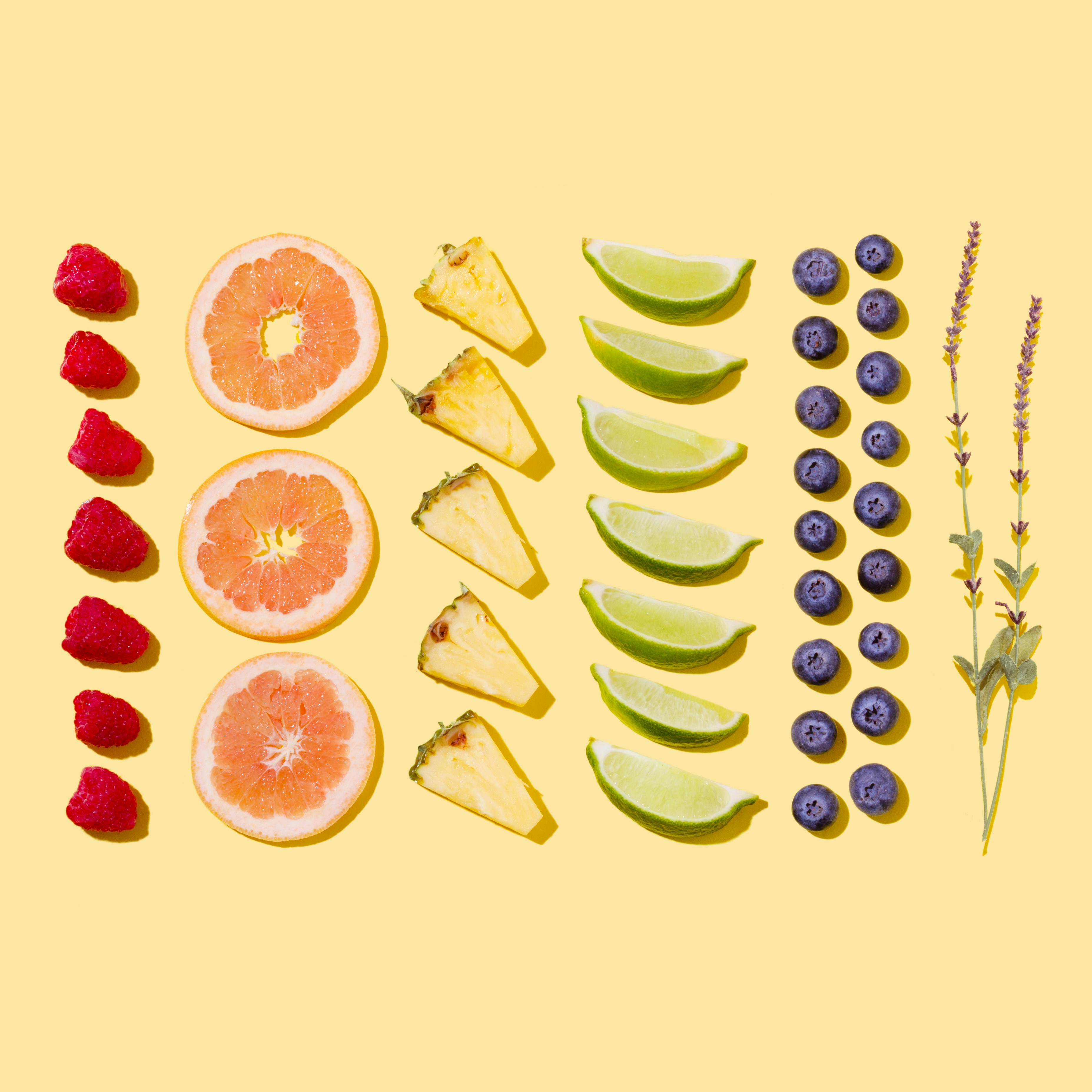 Assorted Fresh Fruits on Yellow Background