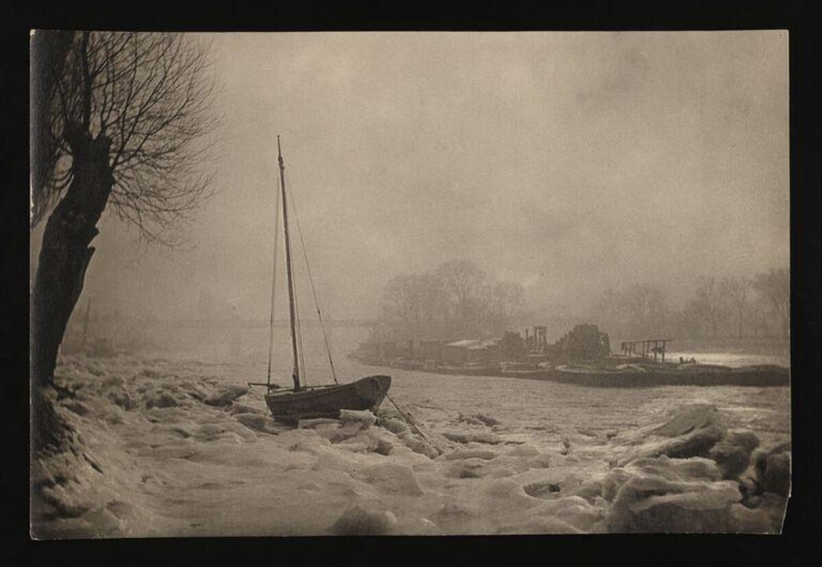 Icebound Sailboat on Foggy Winter River