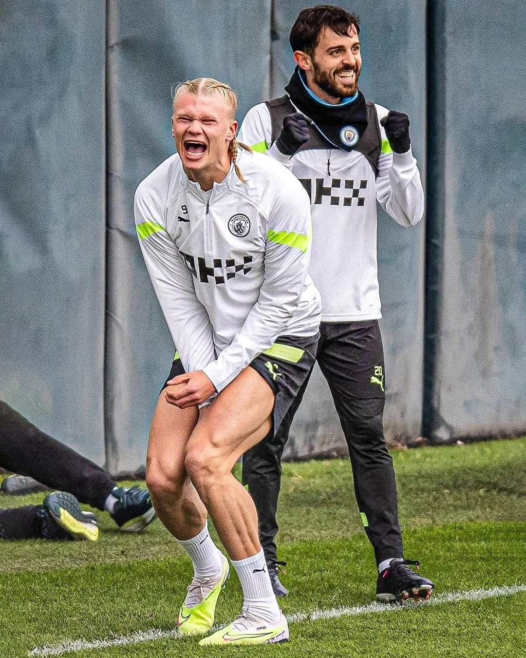Man City players laughing during training