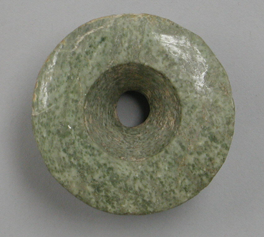 Green Perforated Round Stone Artifact