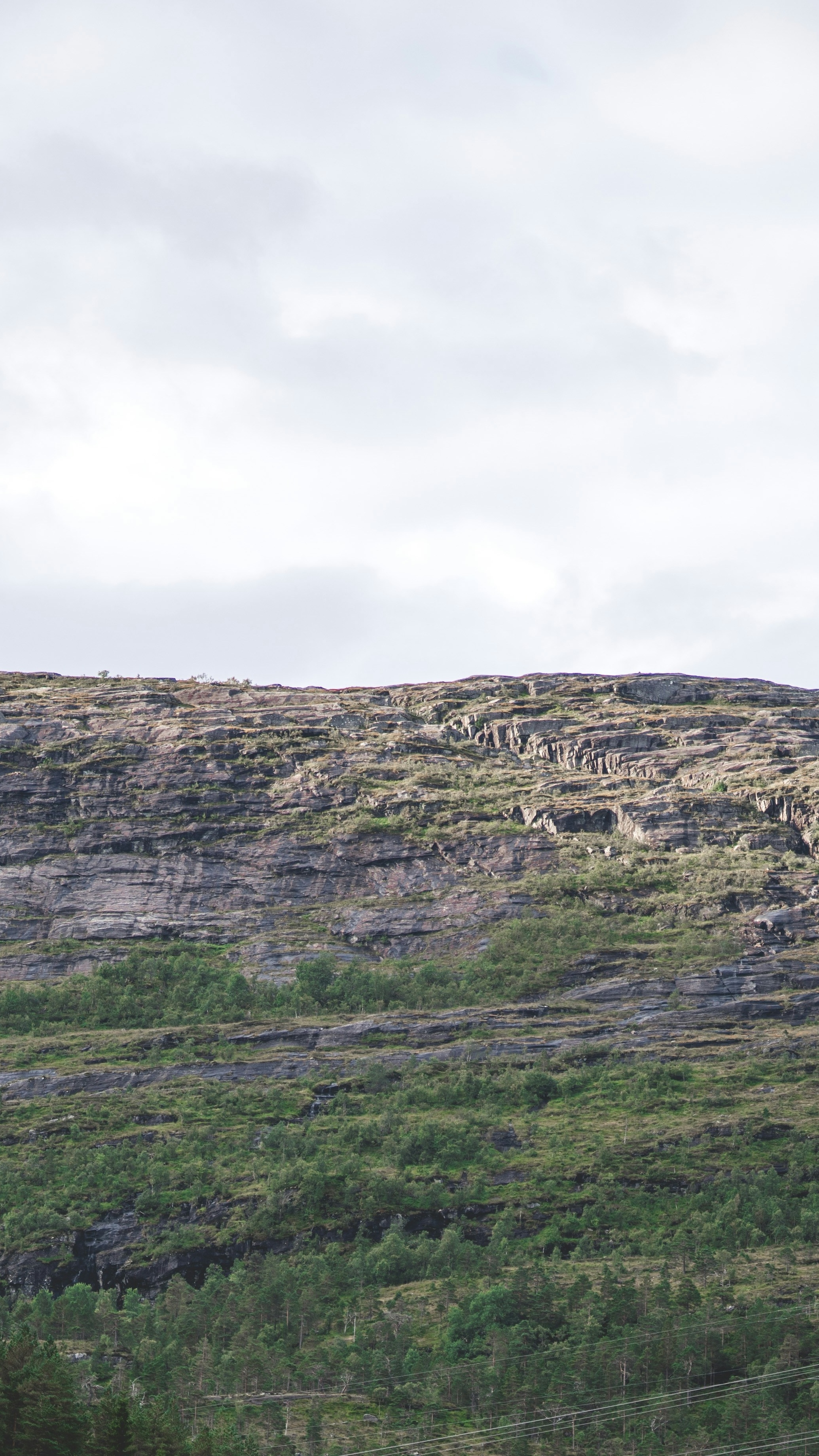 Rocky Mountain Slope Under Overcast Sky