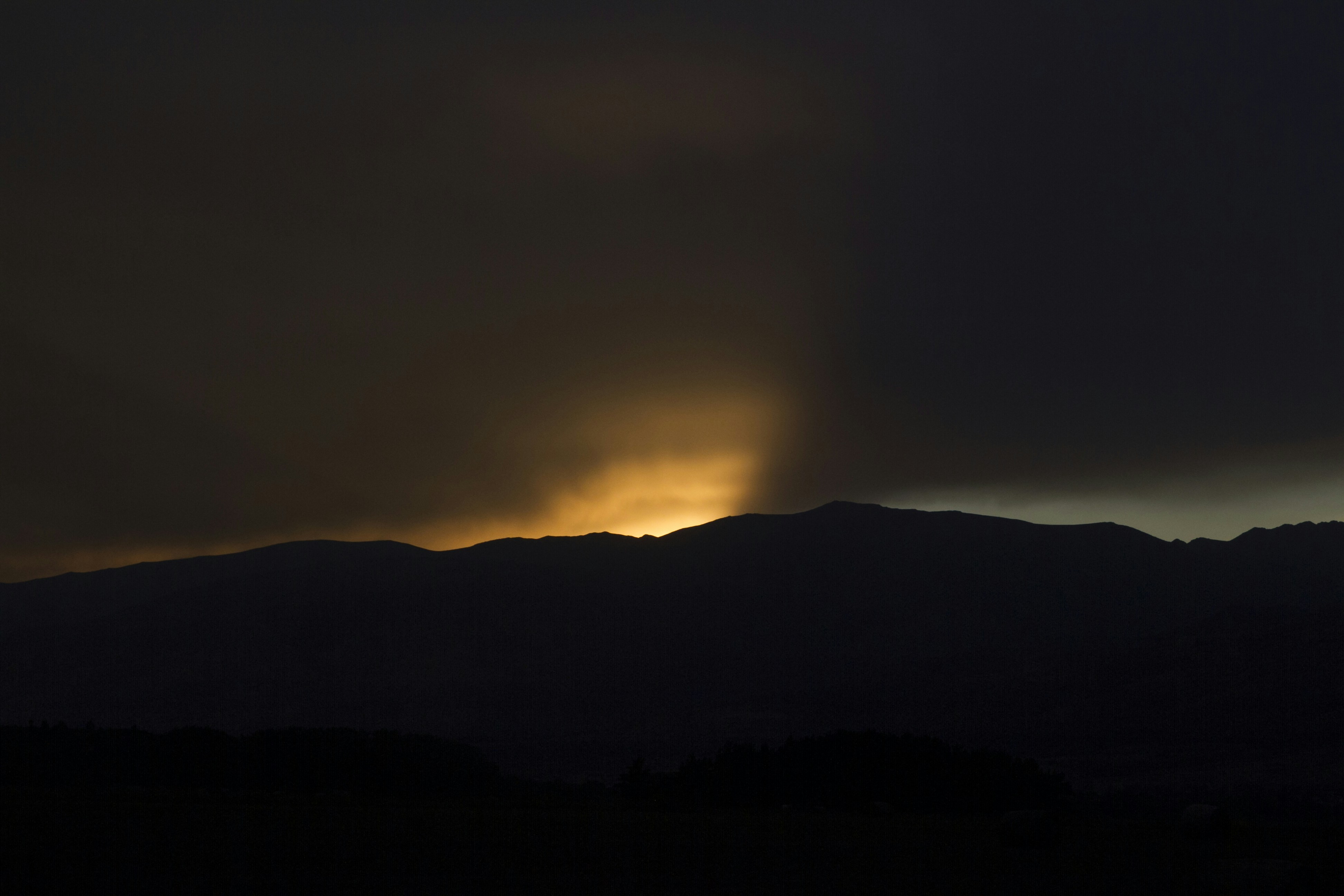 Sunset Behind Mountain Silhouette