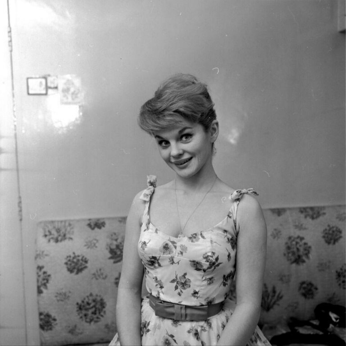 Smiling Young Woman in Floral Dress