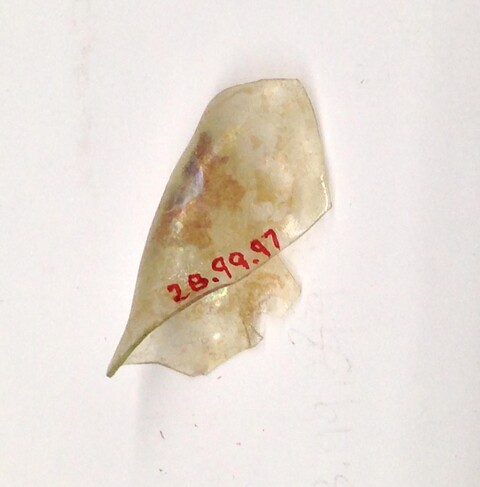 Glass fragment with museum catalog number