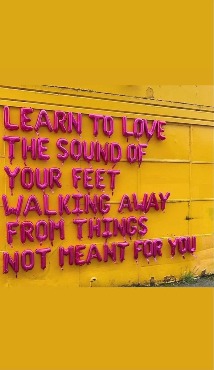 Motivational Quote on Yellow Wall