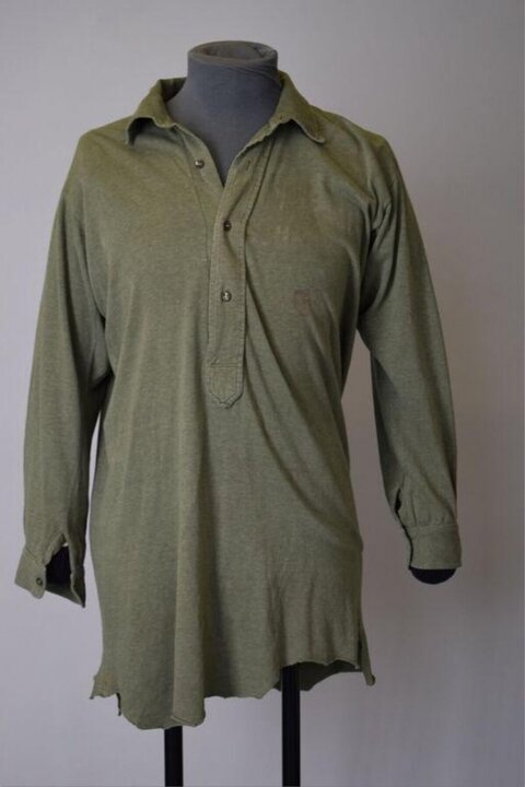 Vintage Green Henley Shirt on Mannequin