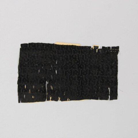Fragment of Black Patterned Textile