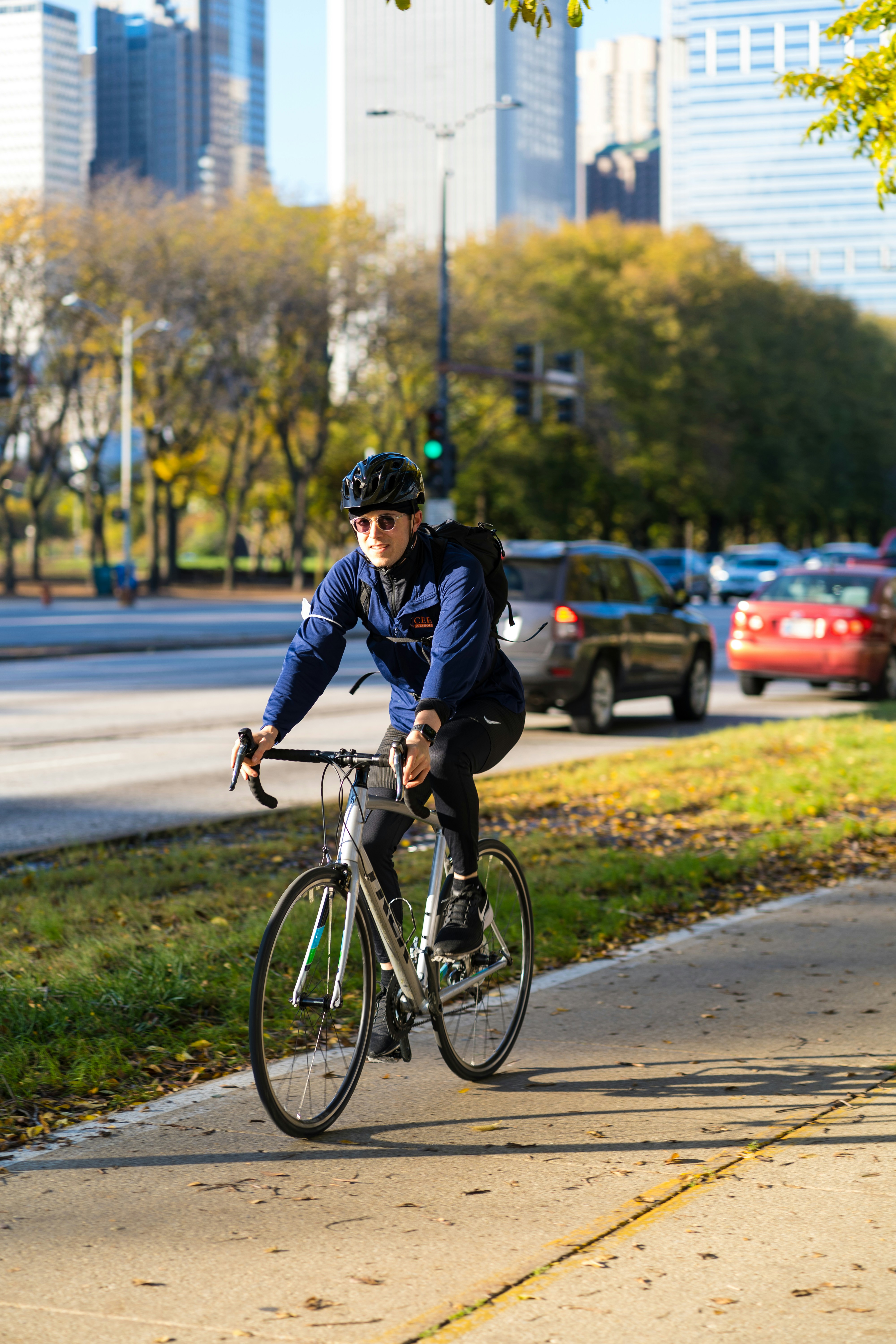 Cyclist Riding on City Bike Path