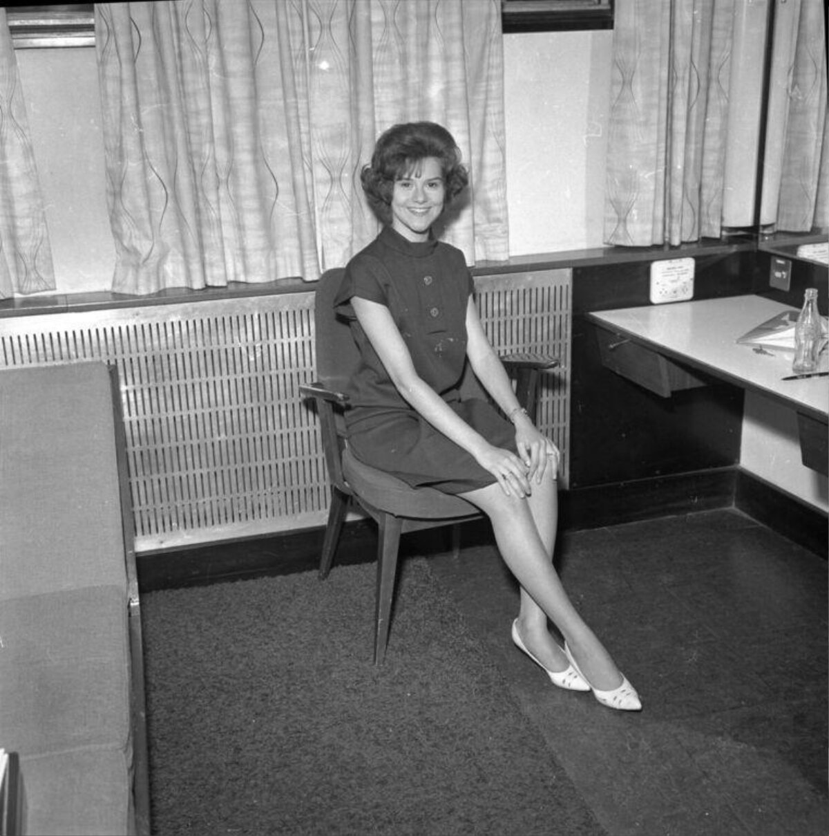 Smiling Young Woman Seated Indoors