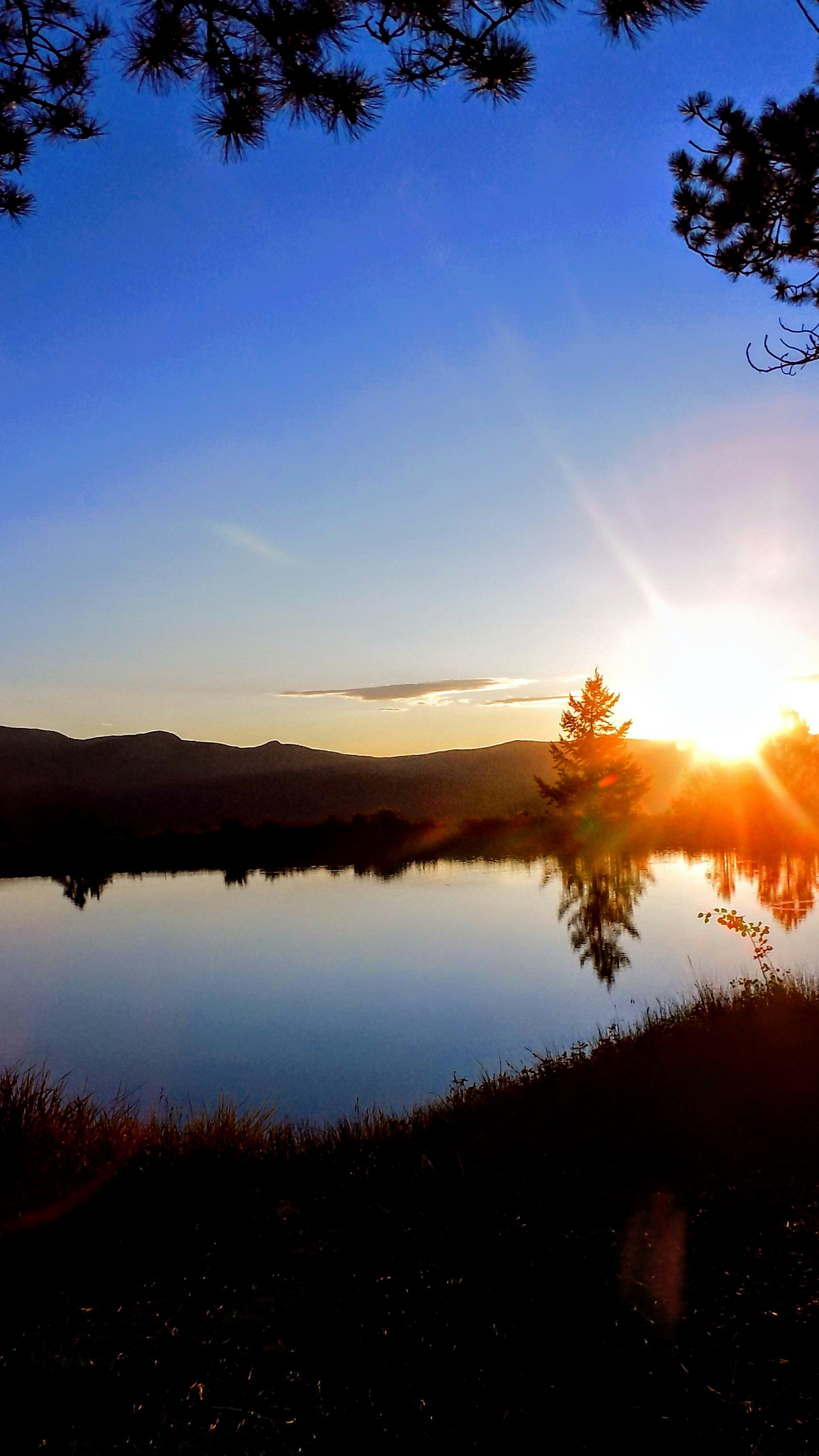 Sunset Over Calm Mountain Lake