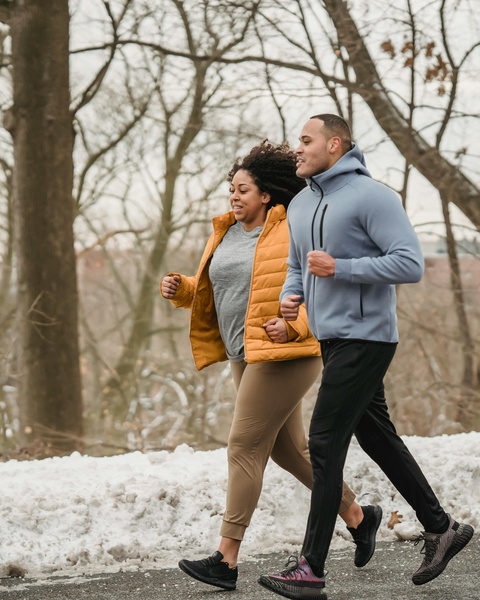 Two People Jogging In Winter