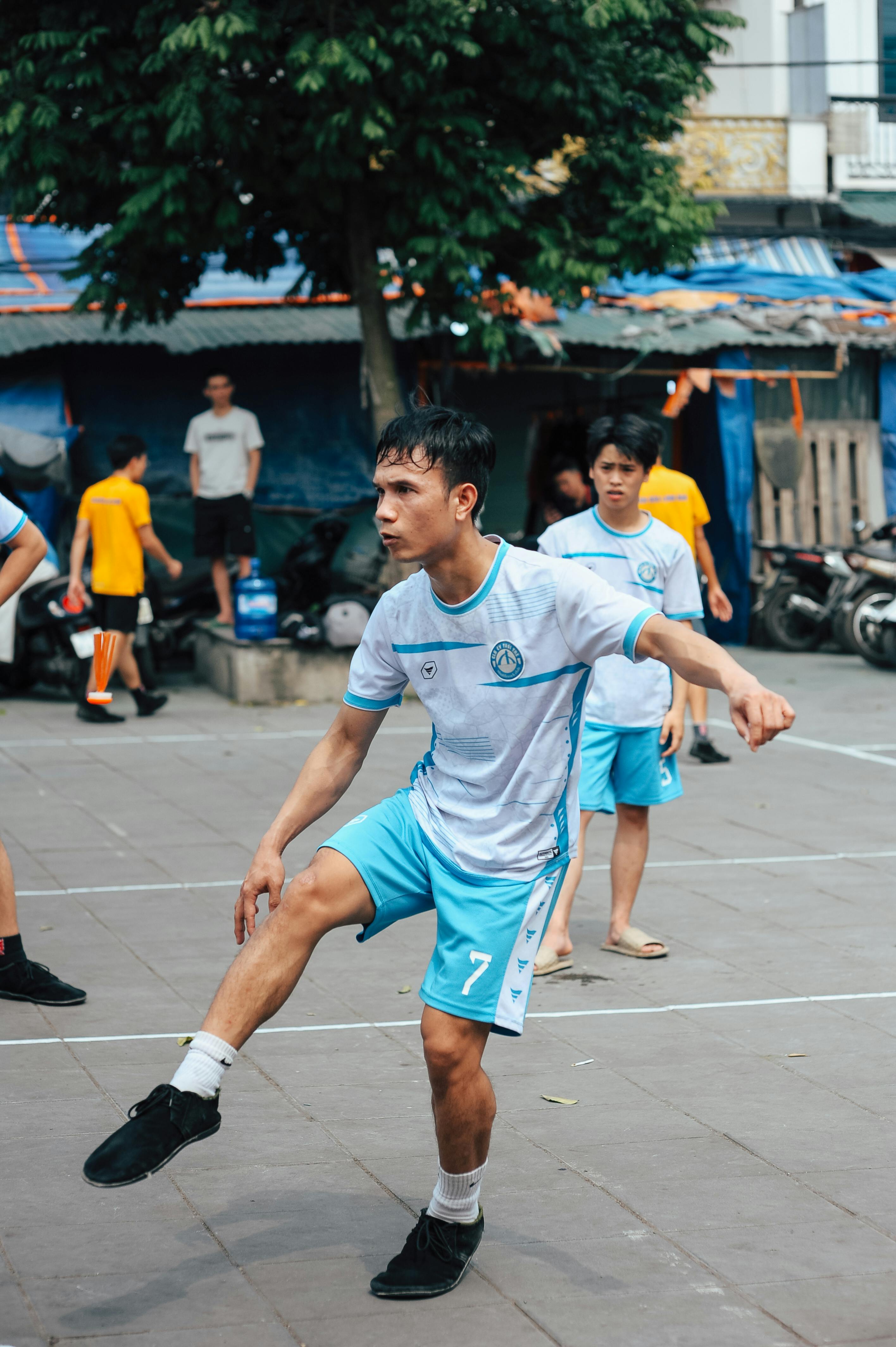 Man Playing Sepak Takraw Outdoors