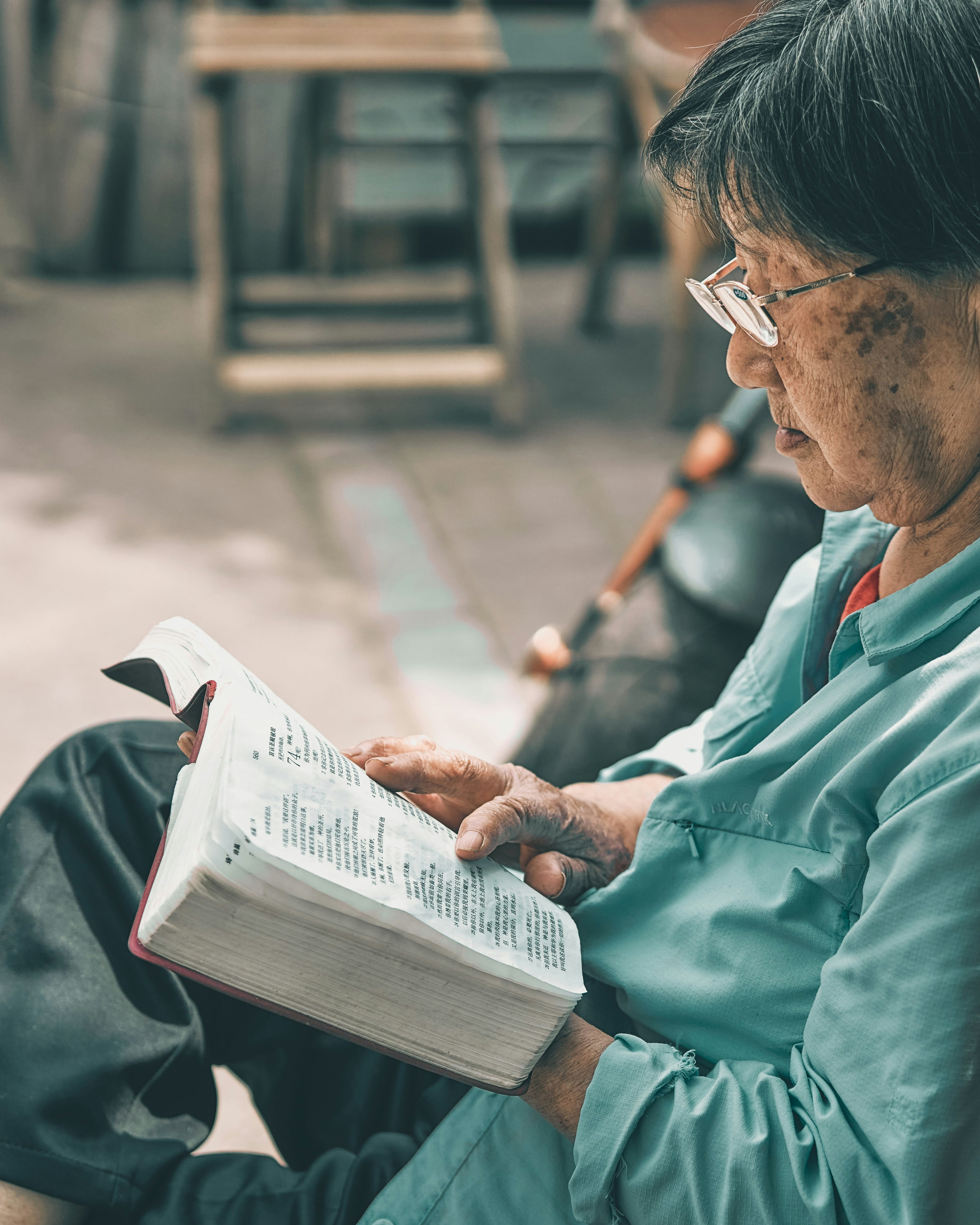 Elderly Woman Reading a Book
