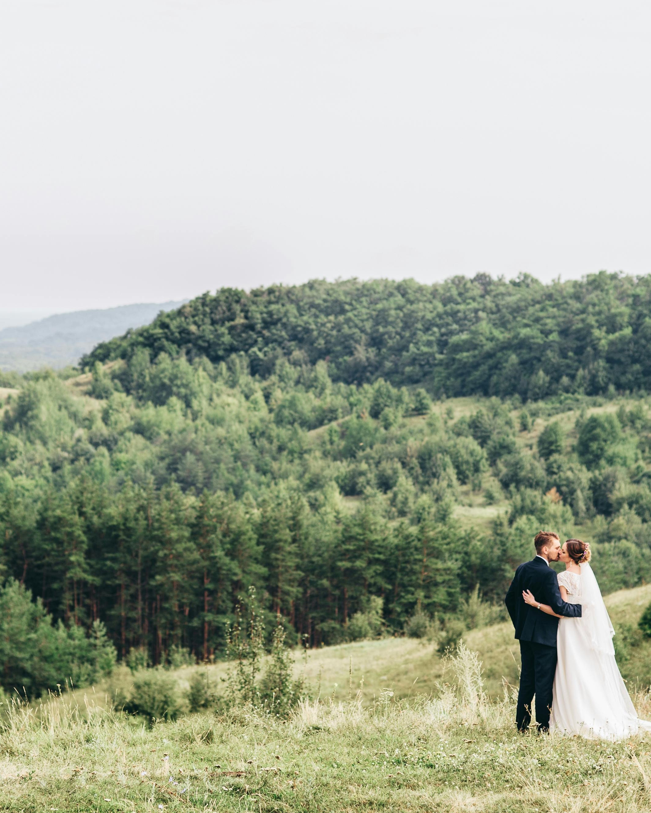 Wedding Couple Kissing In Green Hills