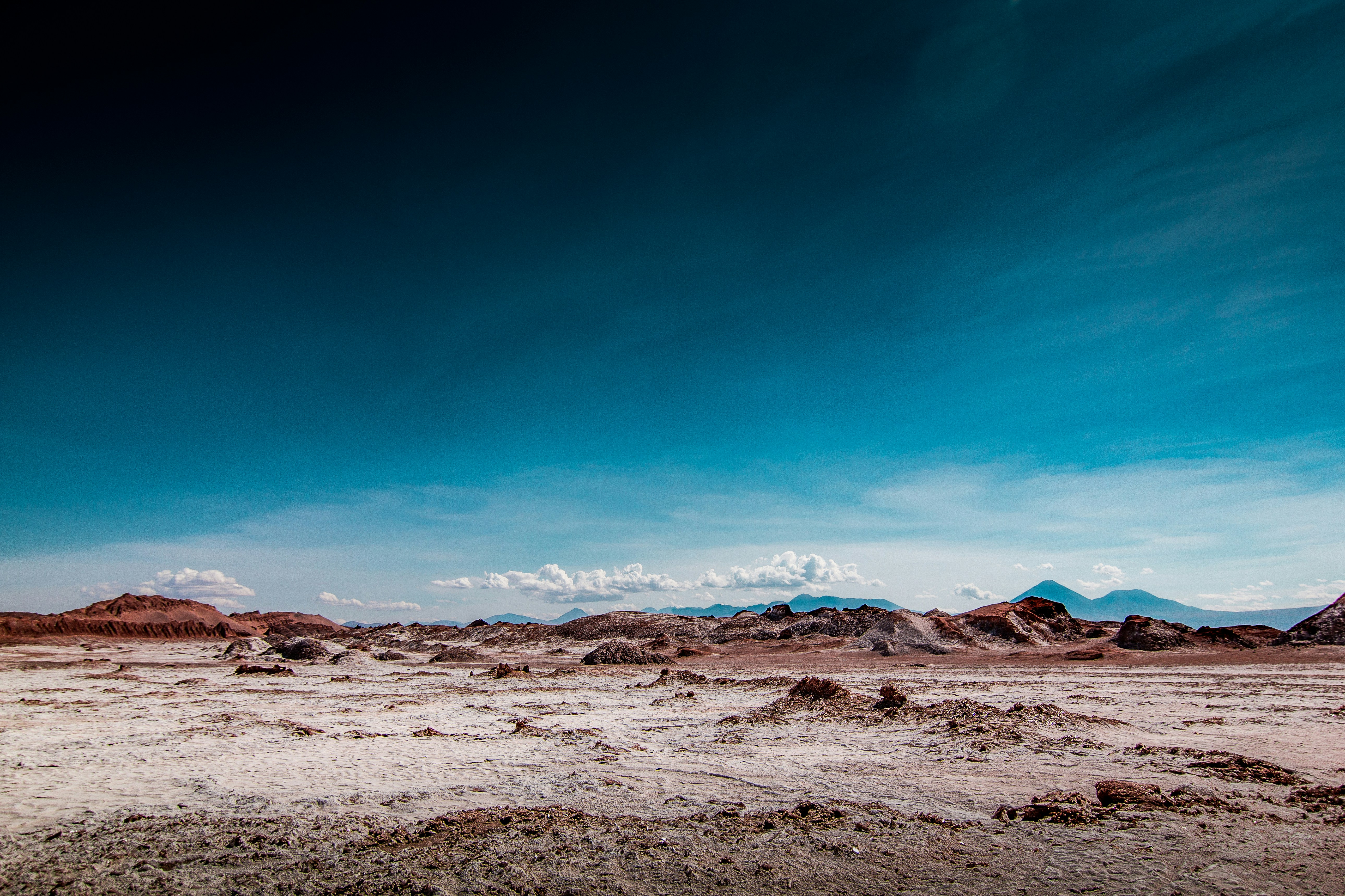 Arid Desert Landscape with Distant Mountains