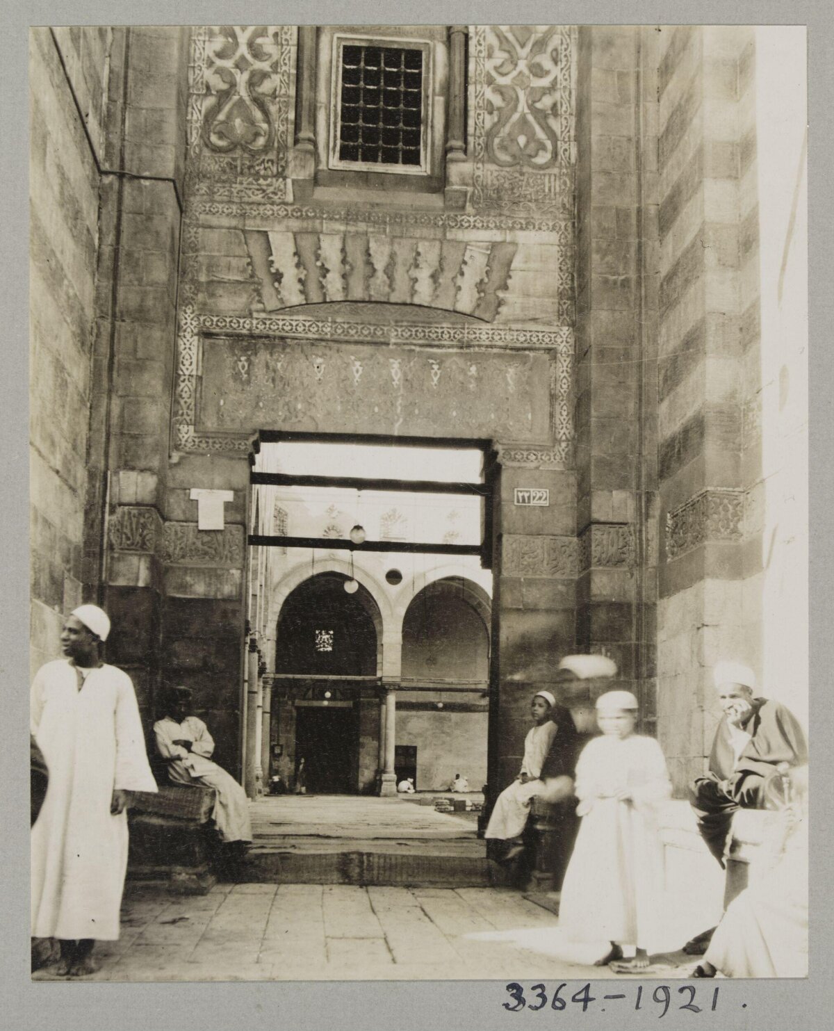Vintage Mosque Entrance with Locals