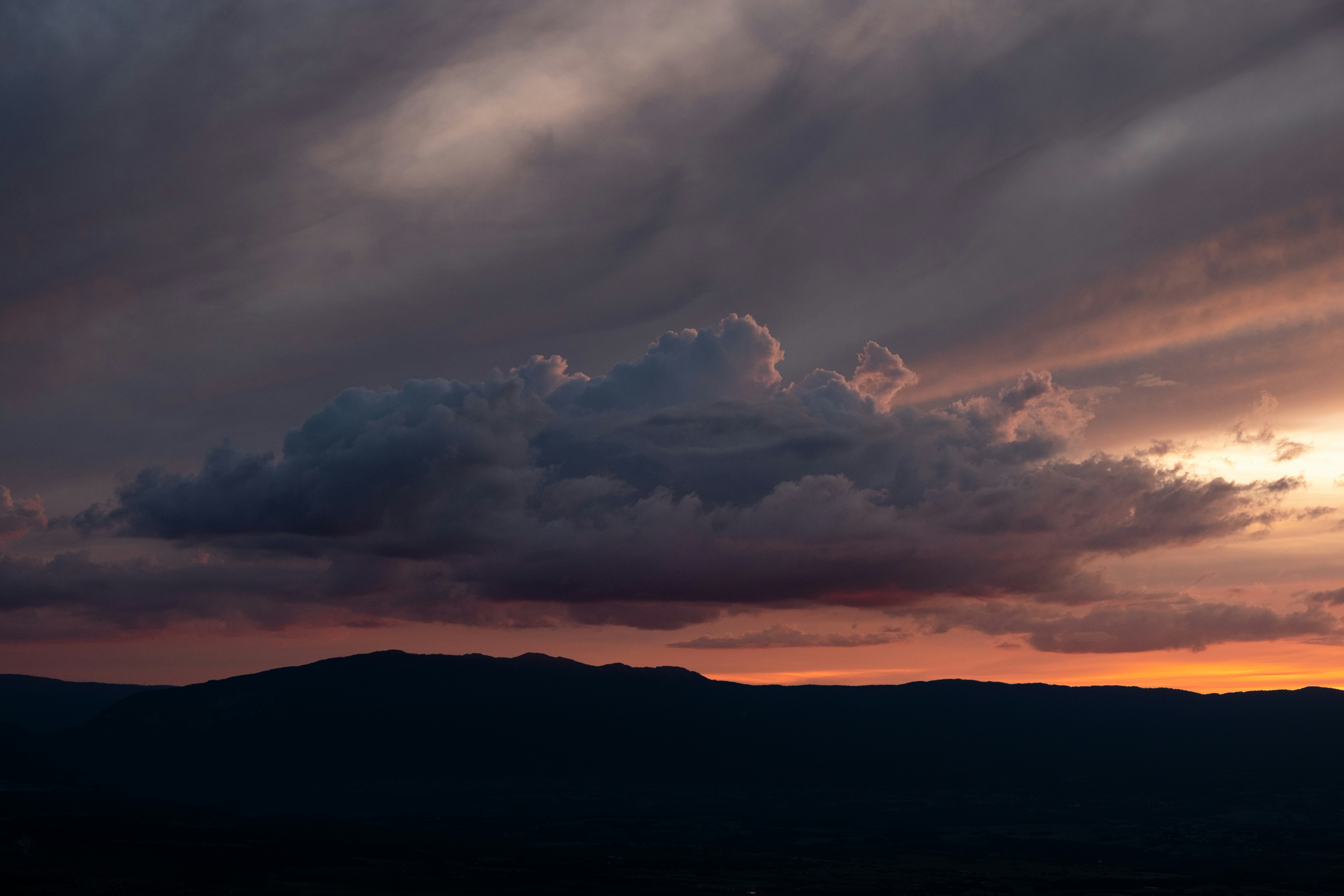 Sunset Sky Over Mountain Silhouette