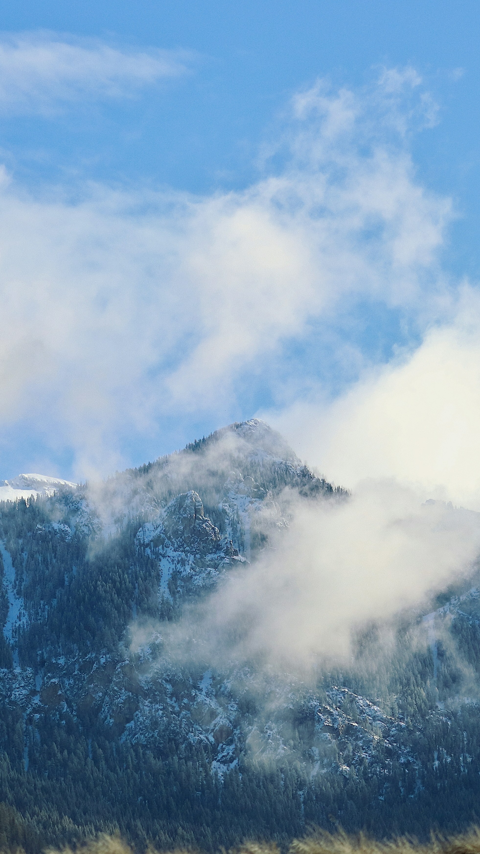 Snowy Mountain Wreathed in Clouds