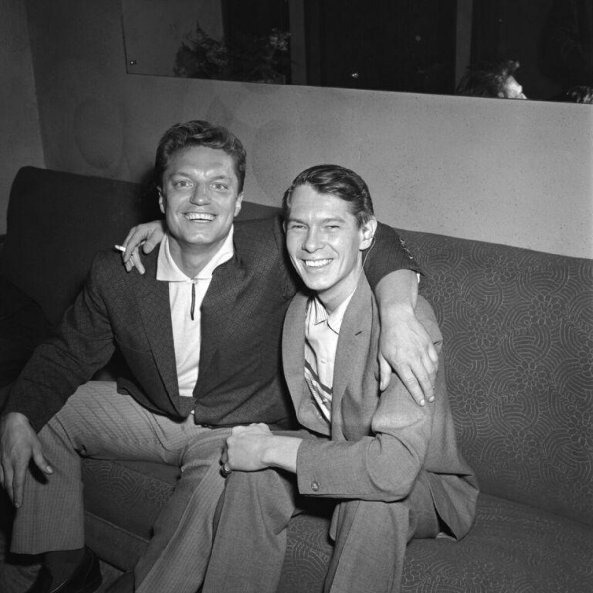 Two Smiling Men on a Sofa