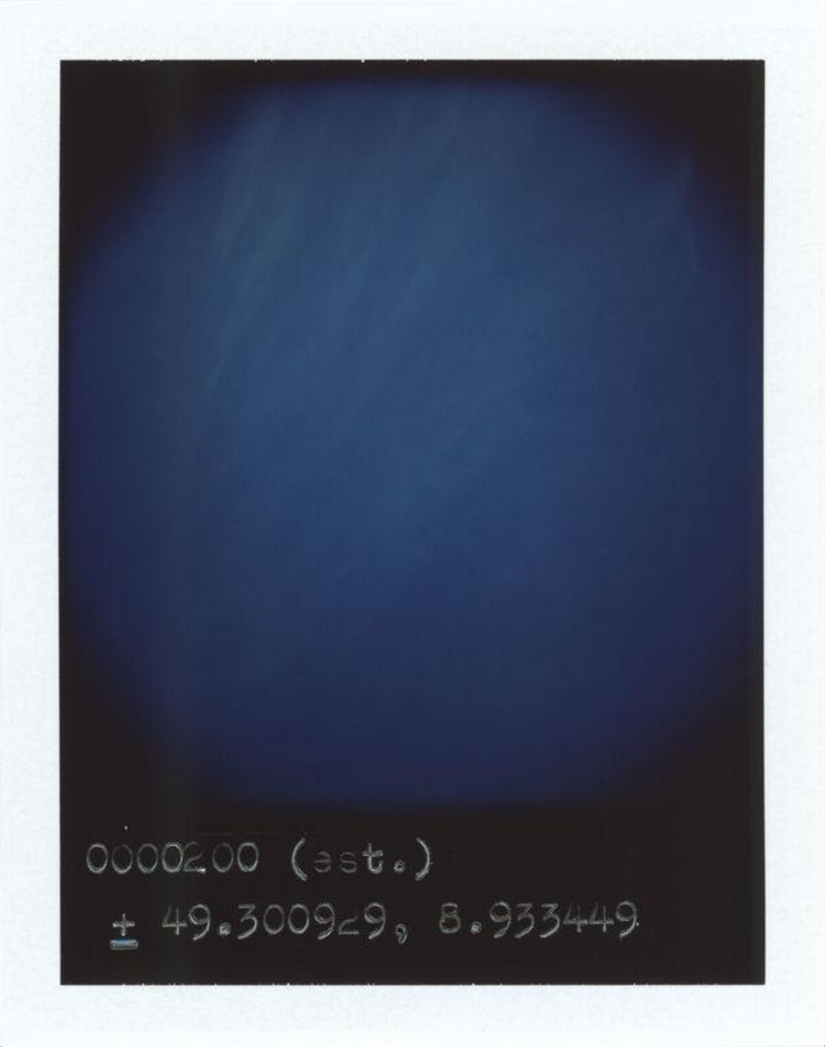 Handwritten Coordinates on Polaroid
