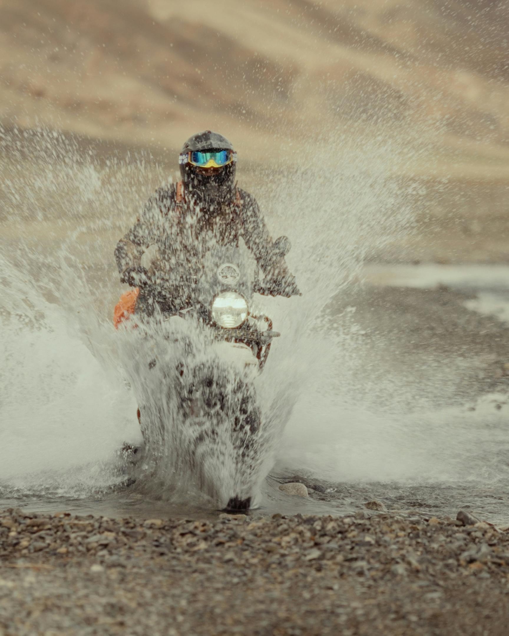 Motorcyclist Crossing Shallow River