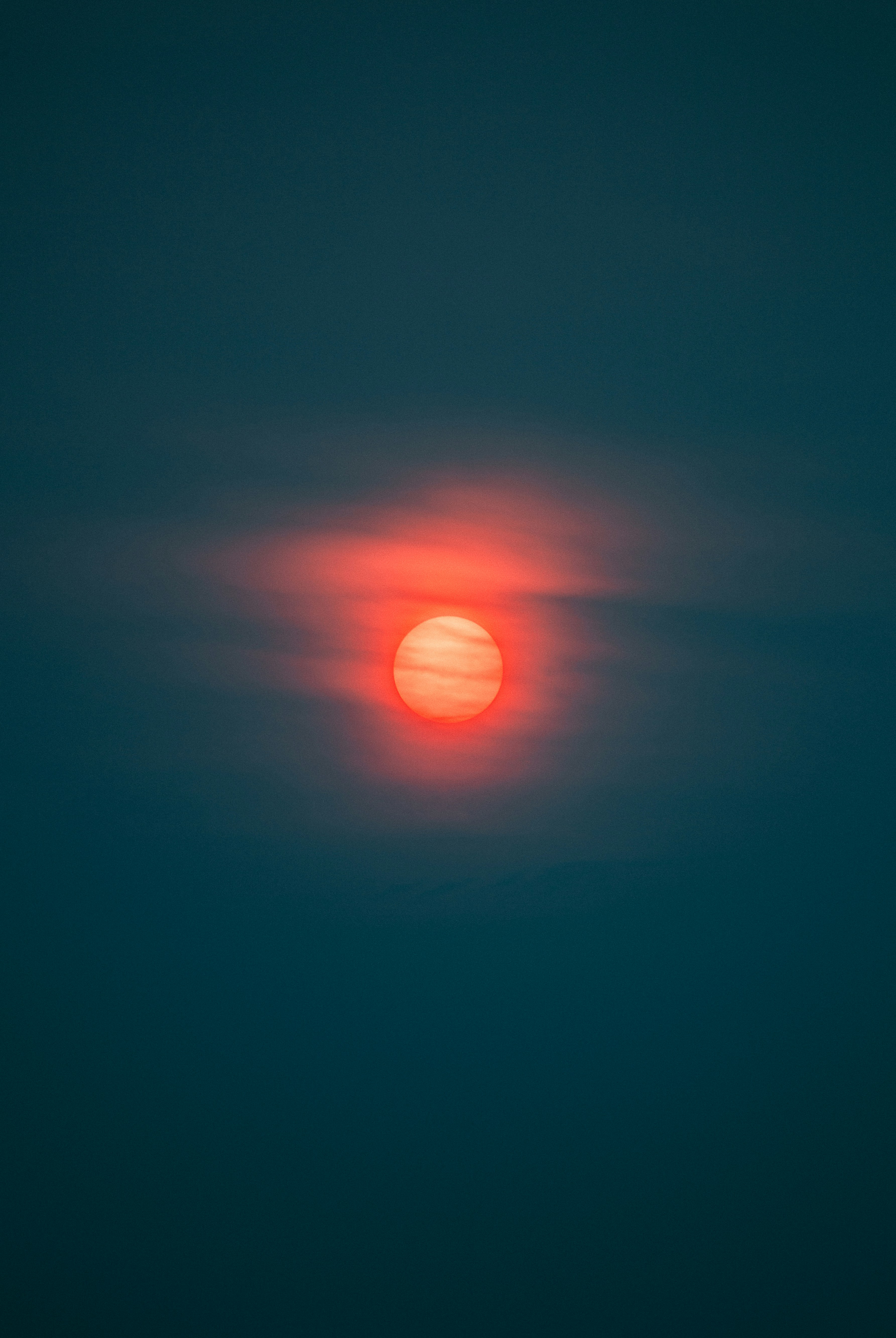 Red Sun in Dark Hazy Sky