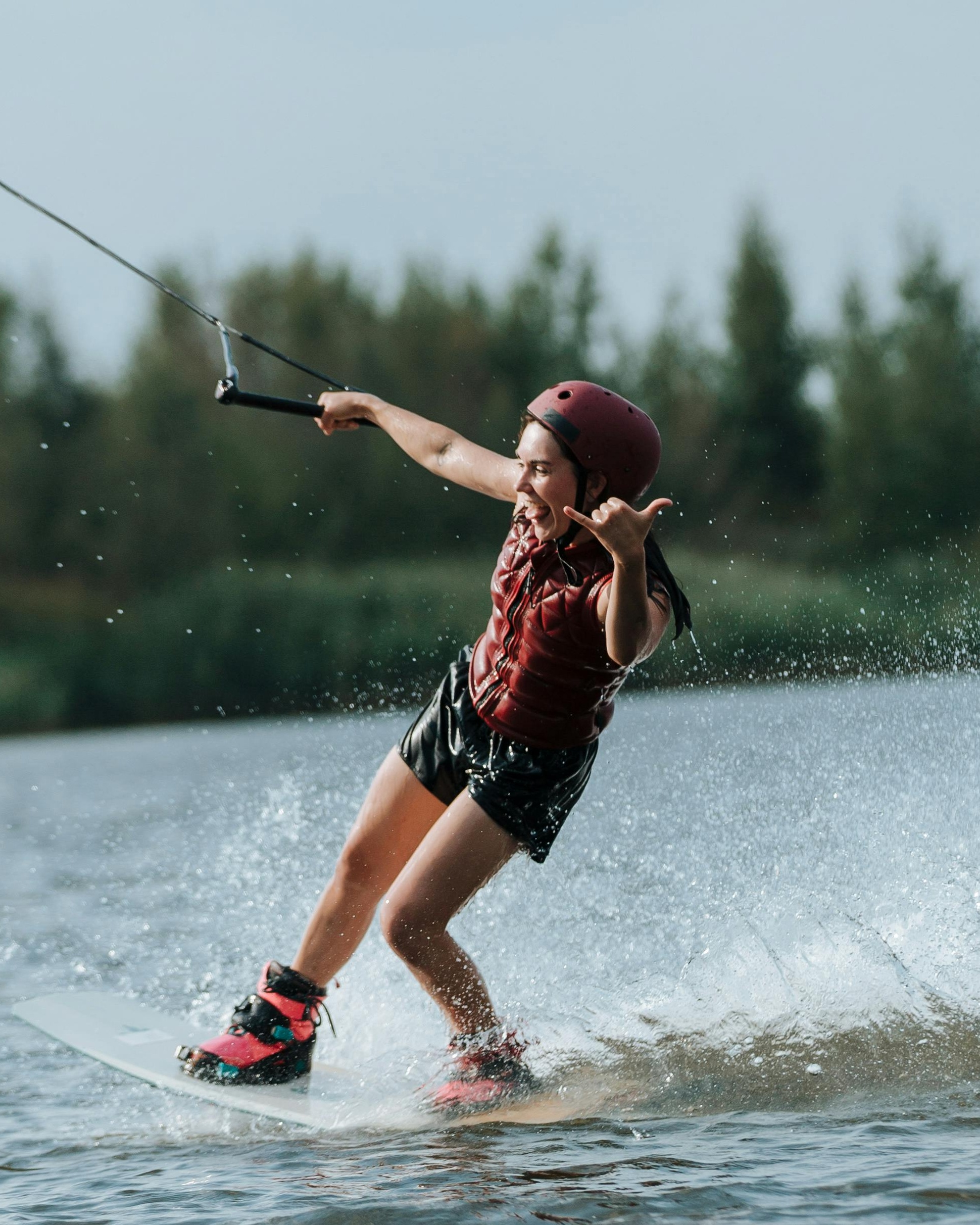 Woman wakeboarding on a lake