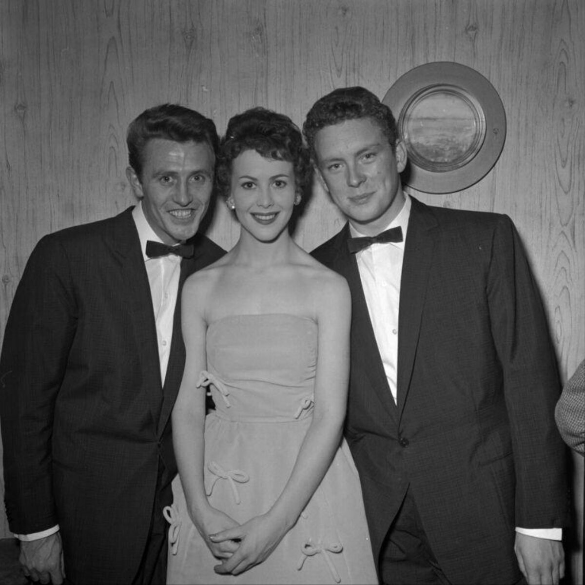 Three Formally Dressed People Group Portrait
