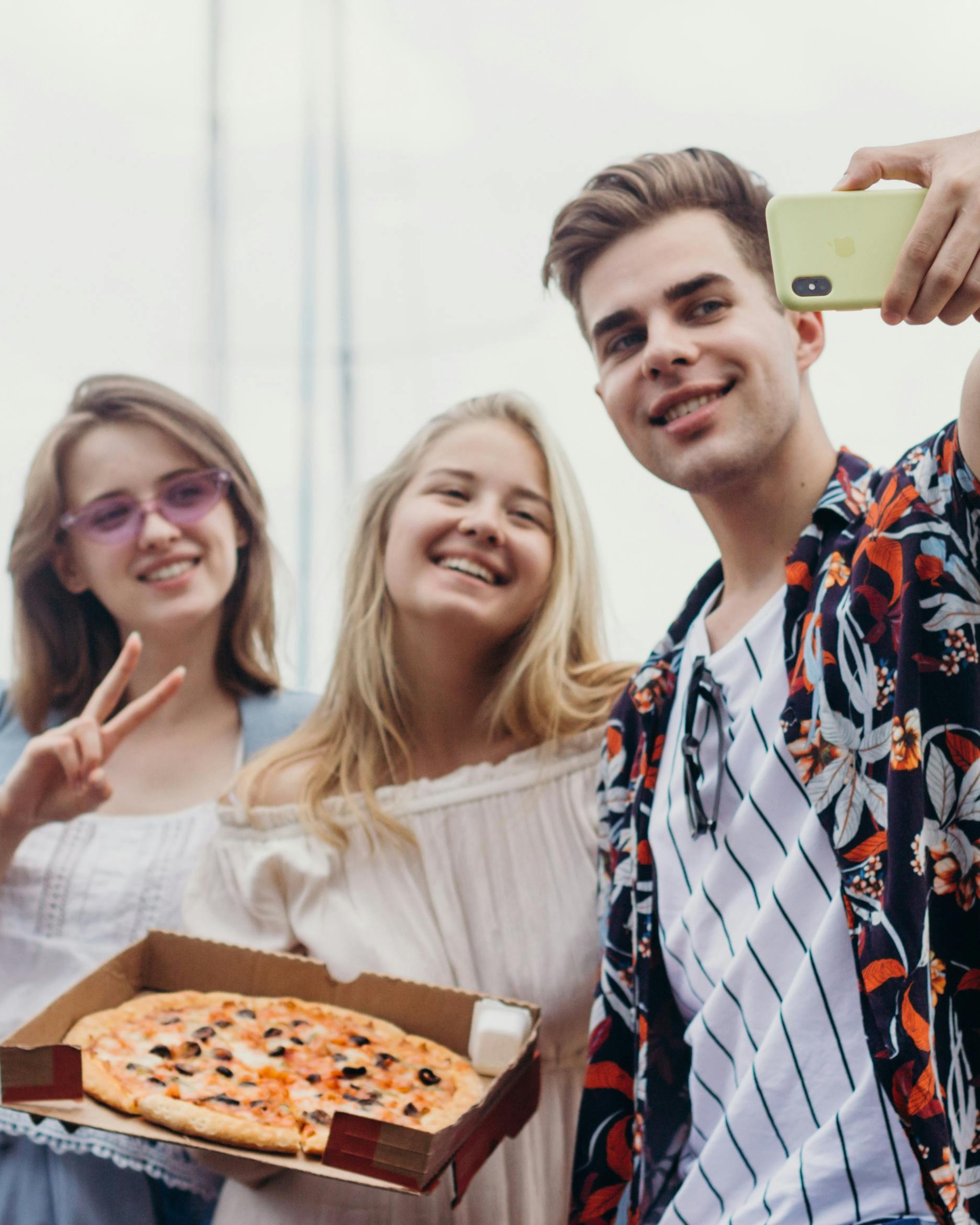 Friends Taking Selfie With Pizza