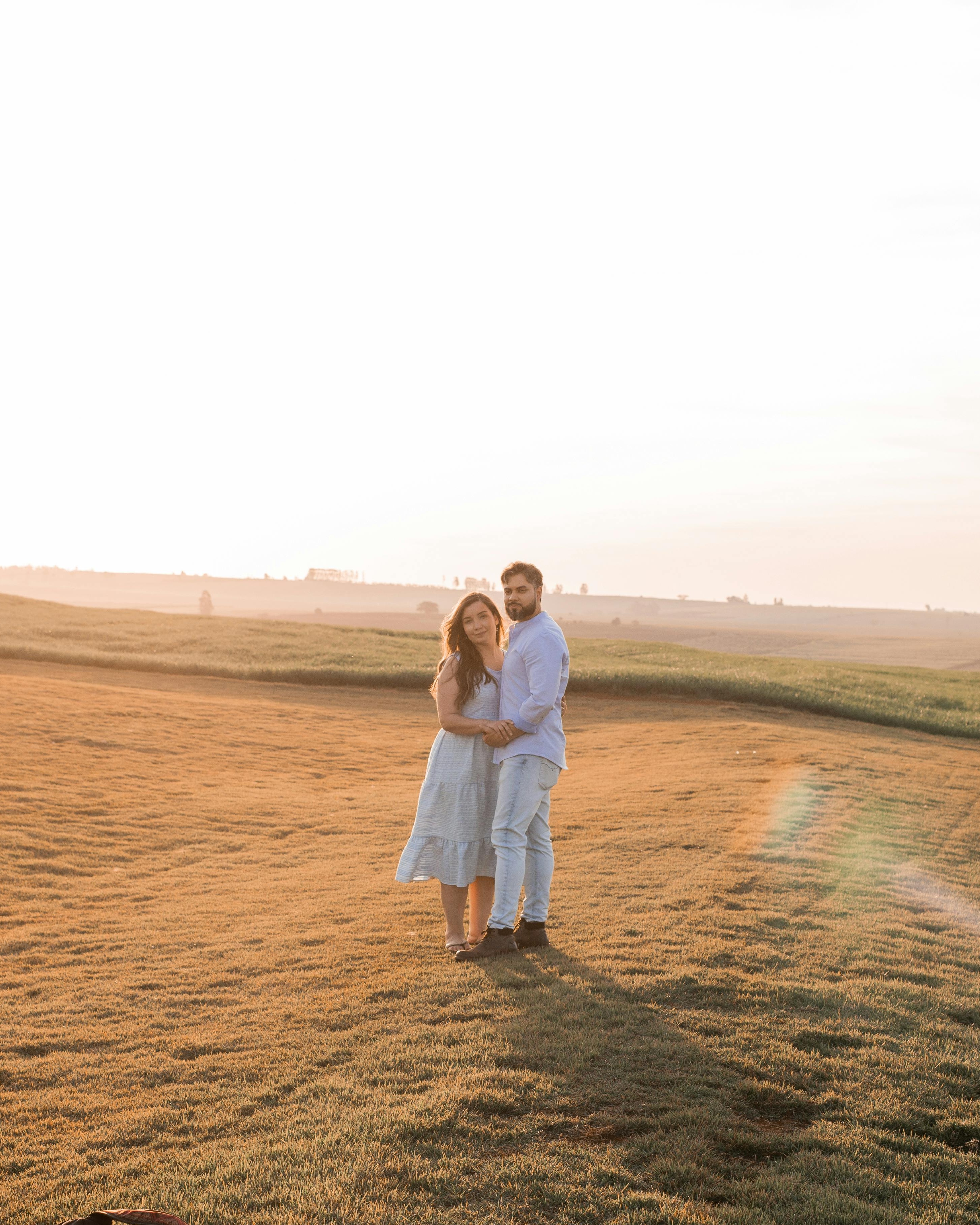 Couple Embracing in Sunset Field