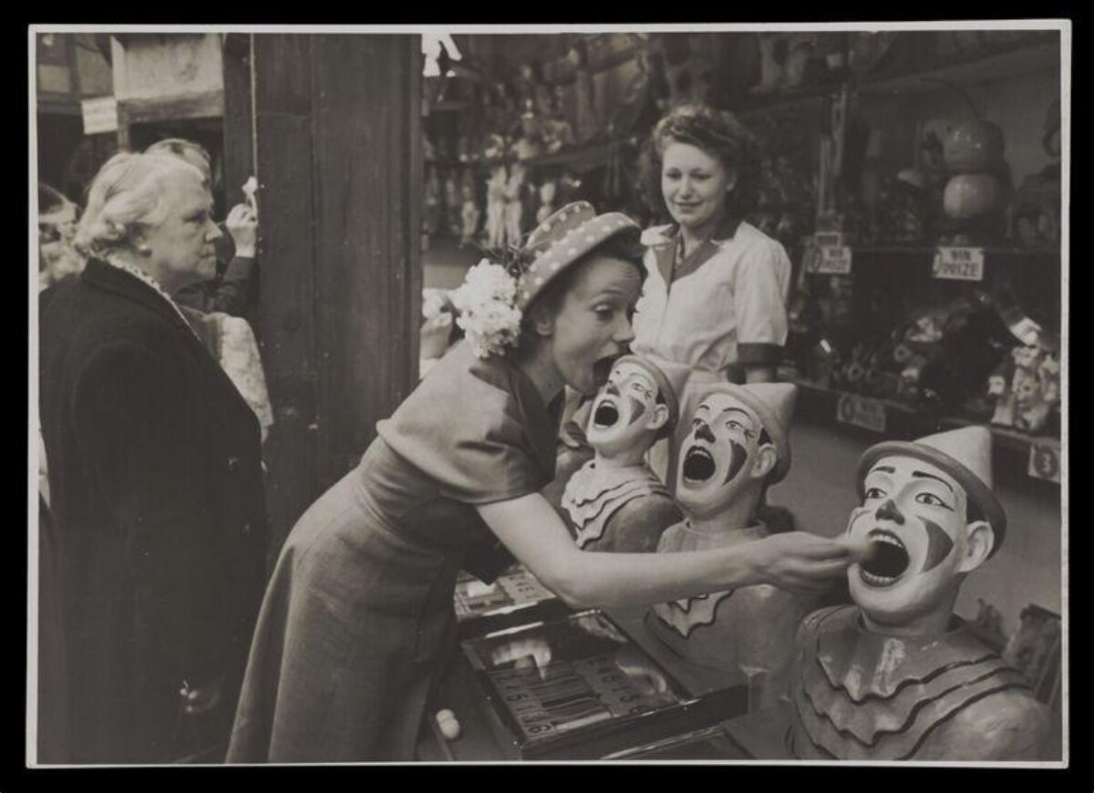 Woman Playing Vintage Carnival Clown Game
