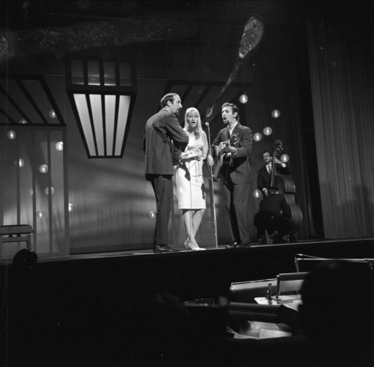 Vocal Trio Performing on Stage
