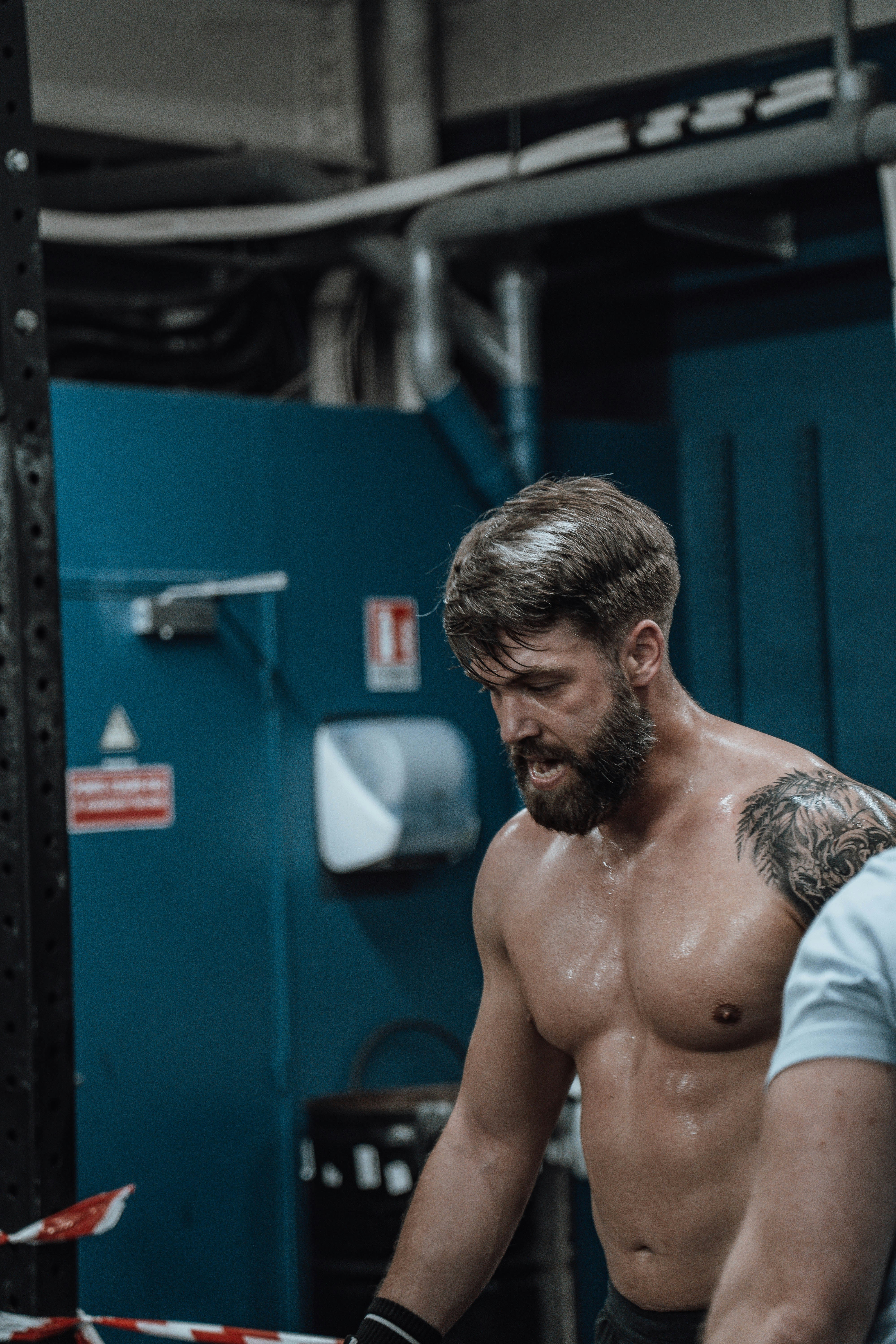 Sweaty Shirtless Lifter in Gym