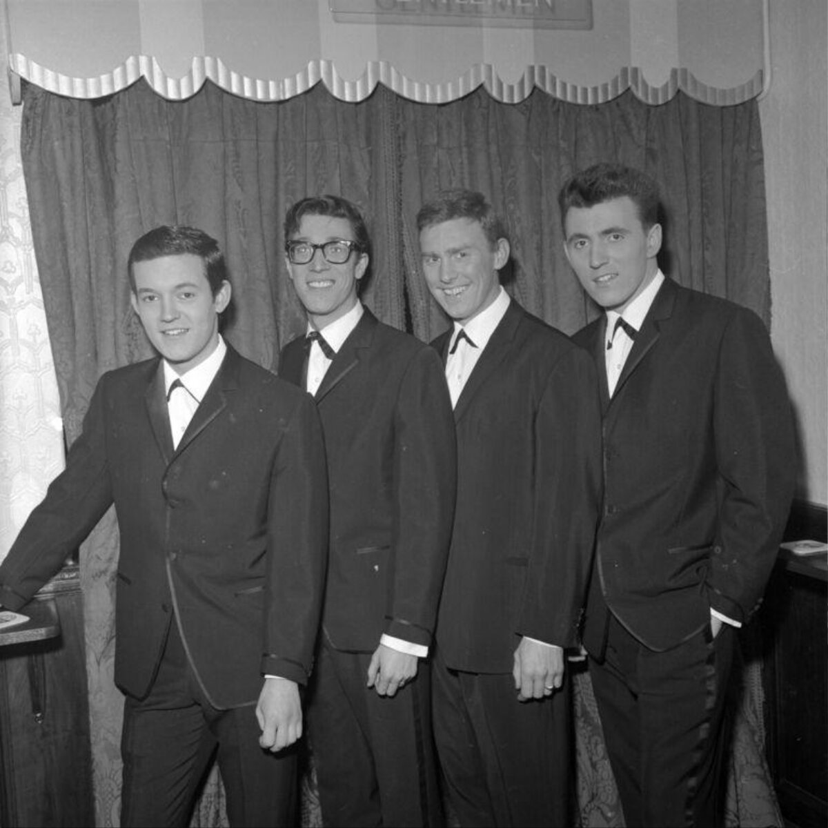 Vintage Portrait Of Four Men In Suits
