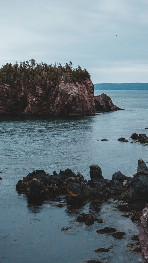 Rocky Coastal Cliffs by Calm Sea