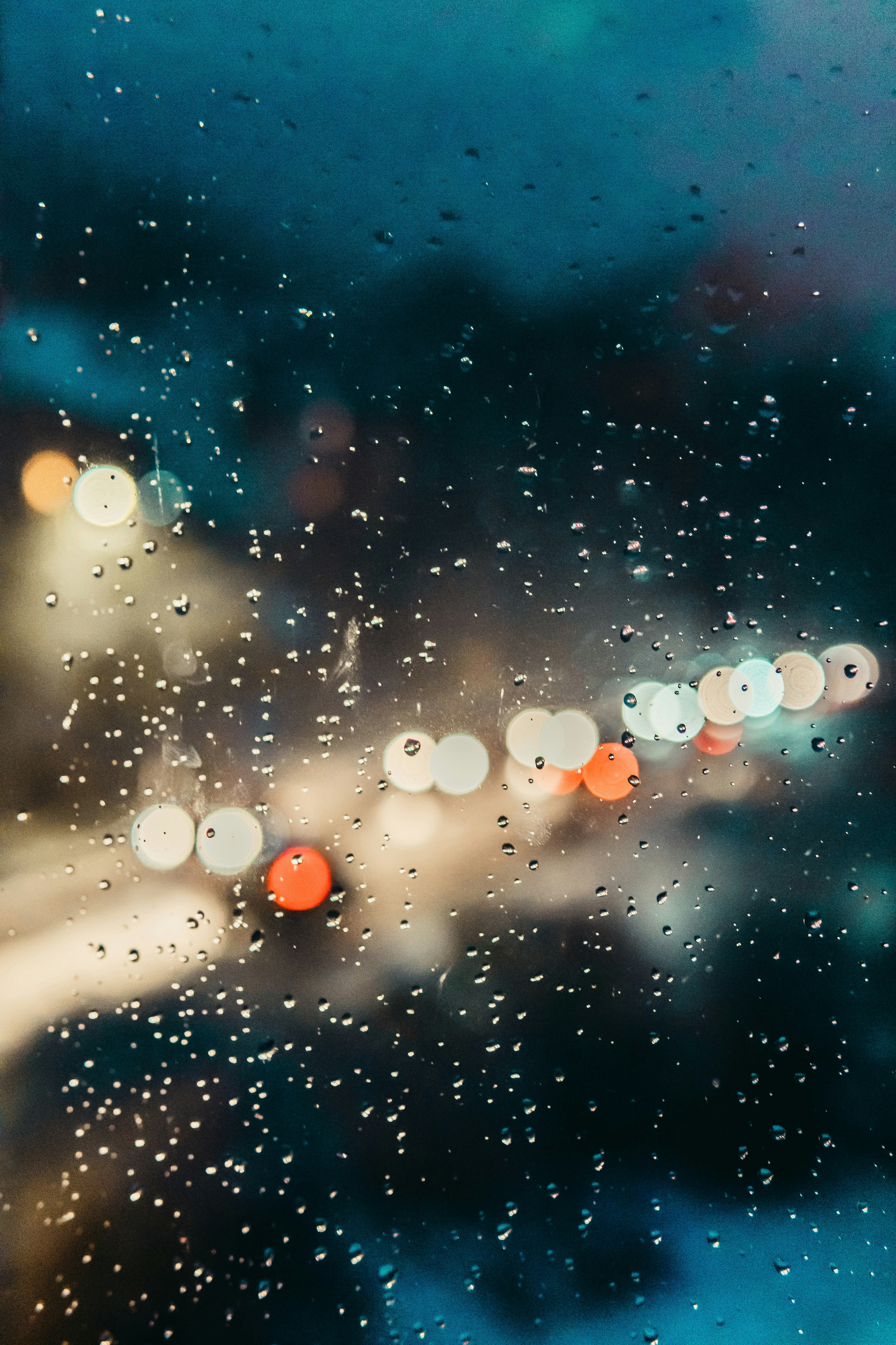 Rainy Night Bokeh Through Wet Window